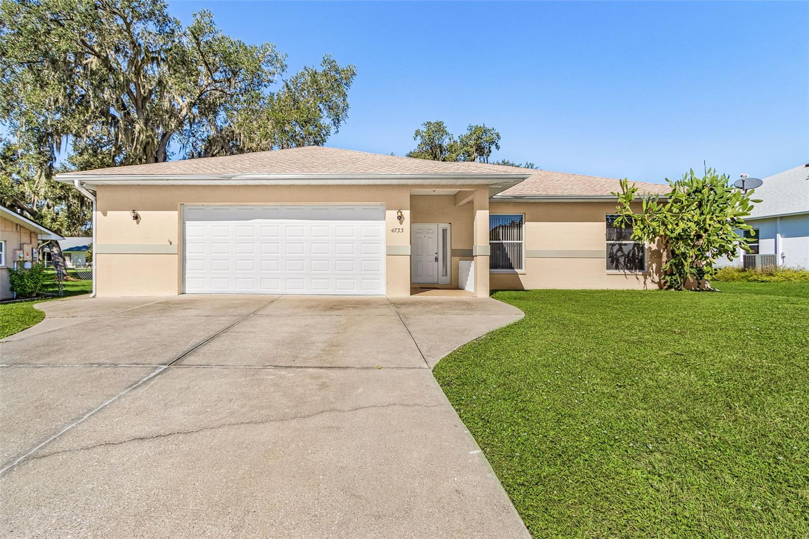 Welcome to 4733 S Cranberry Blvd in North Port! This inviting 3-bedroom, 2.5-bath home features a bright, open floor plan with abundant natural light and a split-bedroom layout for added privacy. Neutral paint throughout and luxury vinyl plank and tile flooring create a welcoming feel. The kitchen offers solid-surface countertops and a breakfast bar for casual dining and gathering. Retreat to the spacious primary suite, complete with a generous walk-in closet and a large bathroom featuring double vanities, a garden tub, separate walk-in shower and access to lanai. Enjoy Florida living on the large lanai or relax on the backyard patio perfect for entertaining and grilling outdoors. An oversized garage and large driveway provide ample parking and storage space, while neighborhood sidewalks add to the appeal. Additional highlights include a roof replaced in 2023, A/C replaced in 2020, newer ceiling fans, a garbage disposal installed in 2016, and a garage door opener installed in 2014. Discover the comfort and space this home has to offer with the conveniences of restaurants, shopping and beaches.