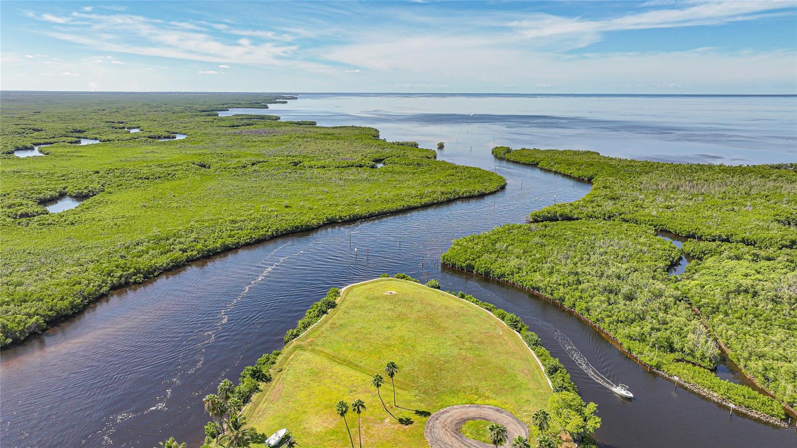 Rare opportunity to own one of Punta Gorda’s premier homesites in the only gated waterfront community in town. This spectacular property sits at the end of Sea Edge Drive, and boasts more than 700 feet of waterfront and approximately 1.49 acres of vacant upland. Build your dream home and enjoy 270° views of Alligator Creek and Charlotte Harbor, both sunrise and sunset exposure, and incredibly fast boating access to open water. Downtown Punta Gorda, Fishermen’s Village, restaurants, shopping, golf, and the airport are all just minutes away.  Don’t miss this opportunity to own a truly exceptional property.