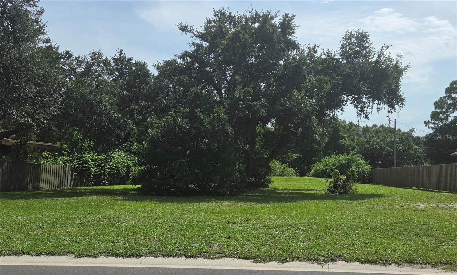 Nicely maintained vacant residential lot located in an established Venice-area neighborhood and ready for its next chapter. An attractive Golden Oak tree adds natural Florida character to the homesite. The property at one time was improved with a residence (which has been removed) and potential impact fee credits may be available for future construction. Buyer should verify eligibility and availability with Sarasota County.

In addition, Sarasota County has confirmed that this property has the potential to be divided into 2 separate properties, one forward toward the street and one further back with a side access drive.  There is also County water adjacent to the property and a gravity sewer line that might be available.  Buyers should investigate and verify the possibilities and cost involved.

Seller had previous house plans designed for the property that included a pool. Those plans are available for buyer's review if desired.  They could give a helpful starting point for envisioning the possibilities for the property. 

Seaboard Avenue is conveniently located near Tamiami Trail (US 41), with easy access to shopping, restaurants, medical facilities, and area beaches. A wonderful opportunity to create your home in an established Venice neighborhood.