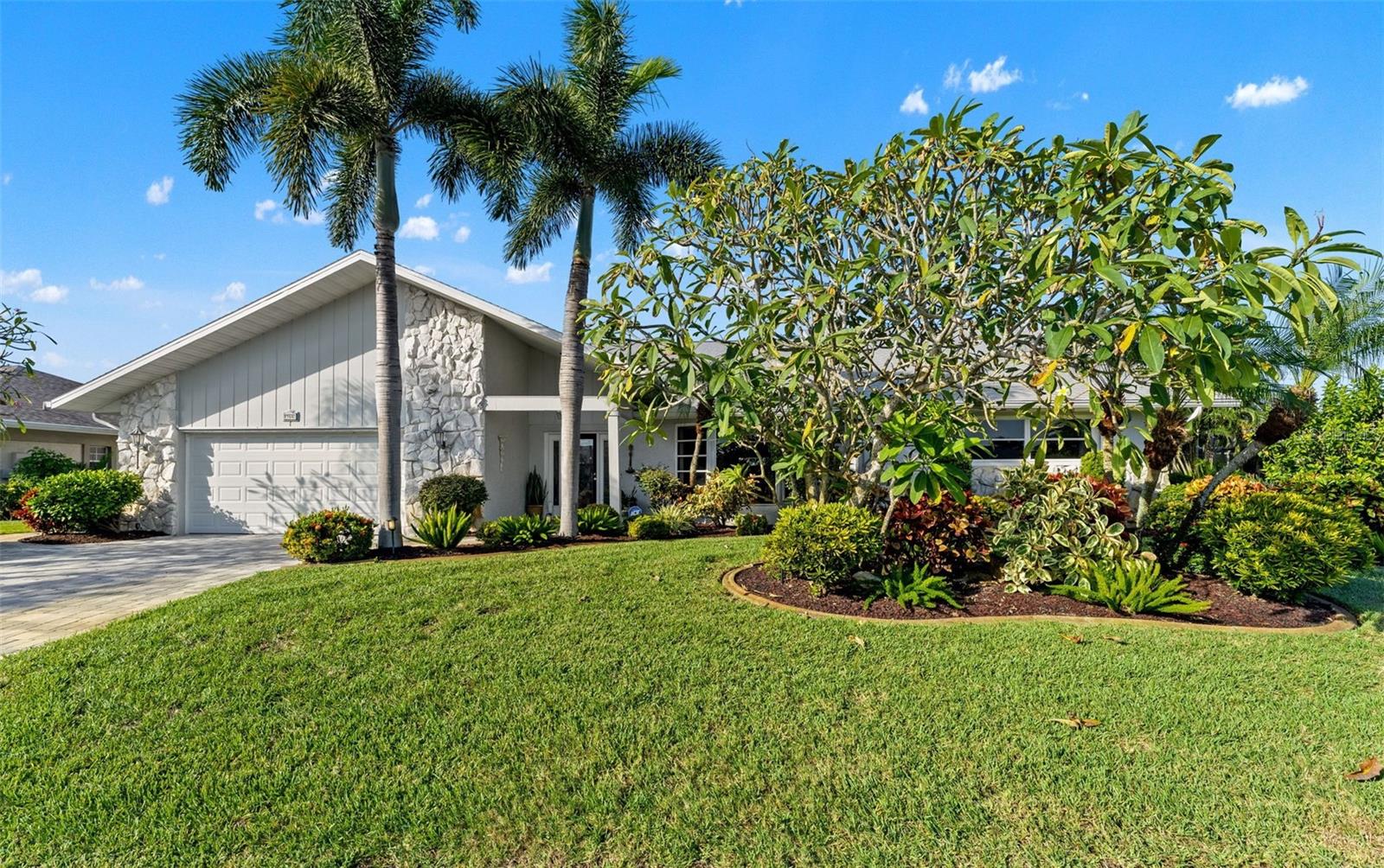 Enjoy beautiful golf course views without the expense of a golf membership in this inviting 3-bedroom, 2.5-bath pool home with a bonus room, a 2-car garage, and a separate golf cart garage with its own garage door, located in desirable Jacaranda West. Featuring PORCELAIN TILE FLOORING THROUGHOUT, spacious living areas, and exceptional indoor and outdoor entertaining spaces, this home offers a wonderful Florida lifestyle with a truly flexible floor plan that allows designing the spaces to tailor your needs.
The great room and dining room are filled with natural light from multiple sliding glass doors that open to the lanai and showcases picturesque golf course views. A wet bar with GRANITE COUNTERTOPS and sink is ideally located near the casual dining area, making entertaining easy.
The kitchen features CUSTOM CABINETRY, GRANITE COUNTERTOPS, UNDER-CABINET LIGHTING, a spacious custom pantry, neutral backsplash, pass-through to the dining room, LAZY SUSANS, SOFT-CLOSE DRAWERS, and abundant storage. The formal dining room overlooks the beautifully landscaped front yard through large windows.
The spacious primary bedroom offers plantation shutters, lanai access through sliding glass doors, and two custom closets. The en-suite bath features DOUBLE VANITIES, an UPDATED MARBLE-TILE SHOWER, GARDEN TUB, three windows with plantation shutters, and a grab bar. The split-bedroom floor plan provides privacy for guests. The third bedroom includes a CUSTOM MURPHY BED, built-in cabinetry, closet, sliding glass doors, and privacy blinds, making it ideal as a bedroom, office, or hobby room. An additional BONUS ROOM offers flexibility for a playroom, office, craft room, fitness room, or den.
The laundry room includes garage access, GRANITE COUNTERTOPS, WHITE CABINETRY, a PORCELAIN SINK, storage, ceiling fan, and plantation shutters.
Major updates include a NEWER ROOF (2021), EXTENDED AND REPLACED PAVER DRIVEWAY (2024), NEW GUTTERS (2025), NEW WATER HEATER (2026), and PROFESSIONAL LANDSCAPING. Situated on OVER A QUARTER-ACRE LOT, the property has been thoughtfully designed and meticulously maintained. The extended paver driveway provides convenient access from the front of the home to the lanai.
The screened lanai is the highlight of the home, offering stunning golf course views, a PRIVATE HEATED POOL, and a SEPARATE IN-GROUND SPA. Both covered and open-air screened areas provide plenty of room to relax and entertain. An OUTDOOR BAR with GRANITE COUNTERTOPS AND A GAS GRILL creates the perfect gathering space for family and friends.
The 2-car garage features an INSULATED GARAGE DOOR, SPECIAL FLOOR COATING, and extensive built-in storage. The separate golf cart garage offers a SPLIT A/C SYSTEM, GENERATOR PLUG, CUSTOM STORAGE, and SPECIAL FLOORING. Previously used as a sewing and craft room, this versatile space can easily adapt to your needs.
Jacaranda West is especially appealing with LOW HOA FEES and NO CDD FEES, allowing residents to enjoy beautiful golf course surroundings without the ongoing expense of a golf membership. Just minutes from Wellen Park, you'll enjoy easy access to waterfront dining, shopping, entertainment, community events, and CoolToday Park, the Spring Training home of the Atlanta Braves. This exceptional home combines quality construction, thoughtful updates, flexible living spaces, and an outstanding outdoor setting in one of Venice's most desirable communities.