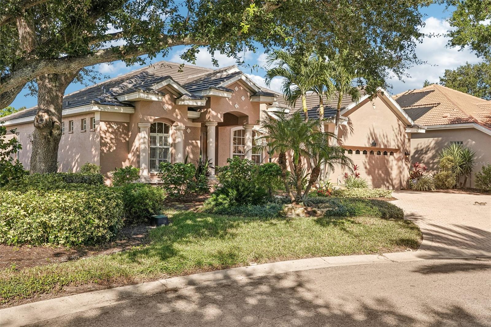 Stunning water views and unforgettable sunsets come with this home. Don’t miss the opportunity to enjoy immediate golf membership and create lifelong memories here. From the living room, your eyes are drawn straight to the water. The family room opens to the kitchen while remaining out of sight from the entry. The thoughtful floor plan features crown molding; tray ceilings in the formal living area and kitchen; combined formal living and dining space; a spacious, well-designed study with remarkable sunset views; and a bright family room and kitchen combination. The spacious kitchen includes a work island, Butler’s pantry, vegetable sink in kitchen island and wood cabinetry. A split floor plan provides privacy for the owners, while a generous guest suite area with two bedrooms and a guest bath can be closed off with a pocket door when desired. A third bathroom also serves as a convenient pool bath. Pocket sliders bring the outdoors in and open the home to an expansive lanai with sweeping lake views—the perfect setting for entertaining. The heated pool has newer solar panels installed in 2023. The lanai was rescreened and all screws were replaced in 2023; the roof was also replaced in 2023, and the A/C unit was replaced in August 2026. Make this home your retreat for years to come. VGCC is a private, member-owned country club featuring a beautiful and challenging 18-hole championship golf course. Beyond golf, members enjoy Har-Tru tennis courts, bocce, pickleball leagues, a junior Olympic-size pool, spa-like facilities, and a state-of-the-art Wellness Center with workout-tracking equipment, an on-site physical therapist, a massage therapist, and personal trainers. The club also offers exceptional dining, varied cuisine, and a newly expanded outdoor dining area. With an active social calendar, welcoming members, and attentive staff, Venice Golf and Country Club provides a vibrant resort-style lifestyle. Ideally located near shopping, dining, and Venice’s beautiful beaches, this home offers an excellent opportunity to enjoy everything VGCC provides. Schedule your appointment today before it is gone. Please note that all owners must be members of this highly social country club.