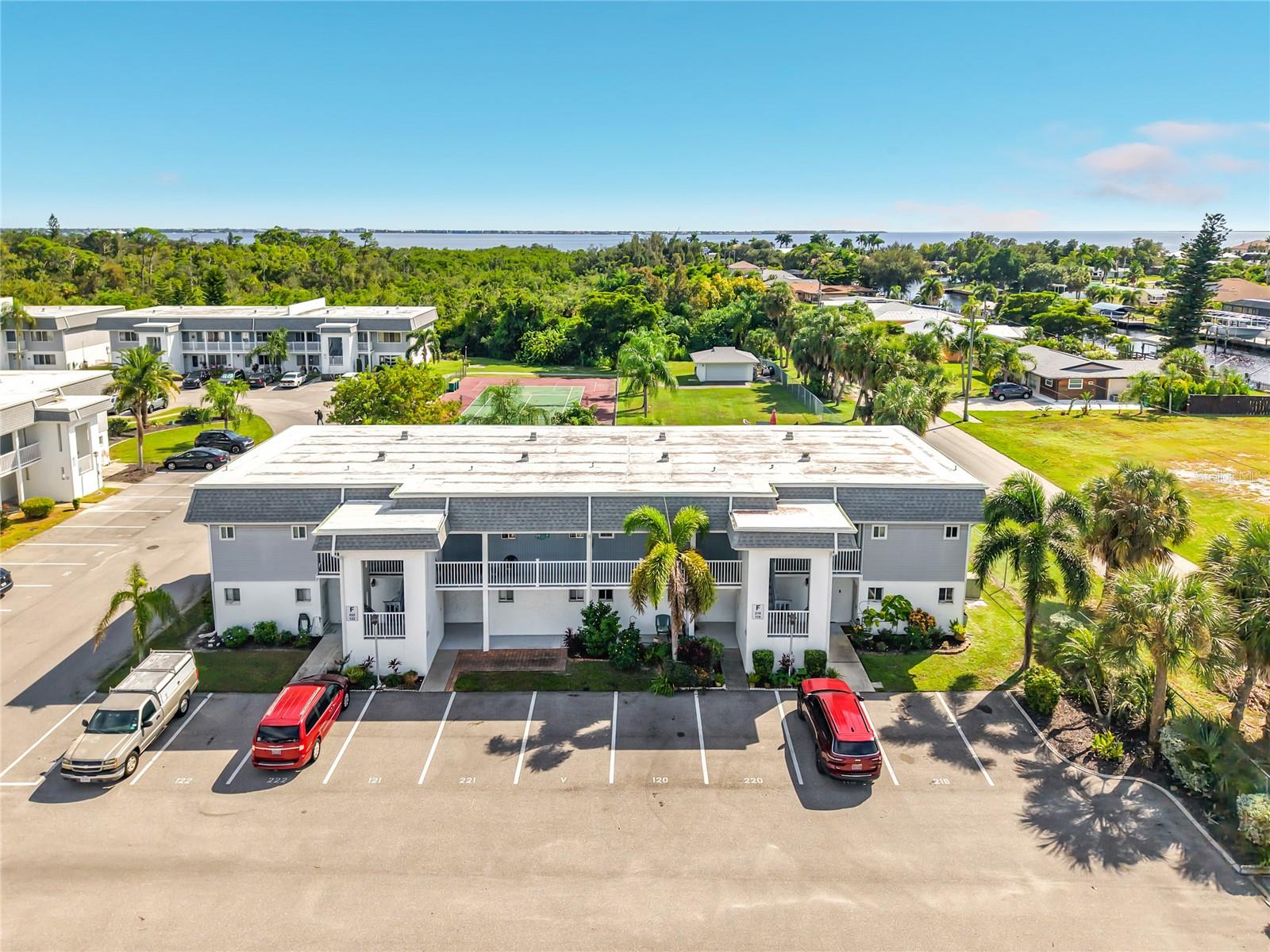 Looking for a TURNKEY cozy place to call home in Port Charlotte just minutes to beaches? This charming and LOW maintenance 1-bedroom, 1-bath condo in the desirable 55+ Edgewater Village, may be just what you're looking for.  Inside this open floorplan, you'll enjoy BRAND NEW luxury vinyl plank flooring, newer appliances, new bathroom features, and more! Step out onto your screened-in covered lanai as it provides you with a nice little space to relax outdoors with friends, enjoy your morning coffee, or unwind after a day at the beach. This unit especially has a grassy backyard area, perfect for your pet to enjoy! This PET FRIENDLY community gives you plenty to do without having to go far! Enjoy the community pool, tennis courts, pickleball, shuffleboard and more! SHORT TERM RENTALS allowed, giving you flexibility to use this as your own seasonal Florida getaway, a full-time home or an investment property with rental potential. Conveniently located 6 minutes to downtown Punta Gorda, beaches, restaurants, shopping and entertainment. If you've been wanting a simple Florida home that gives you options, this one is worth a tour!