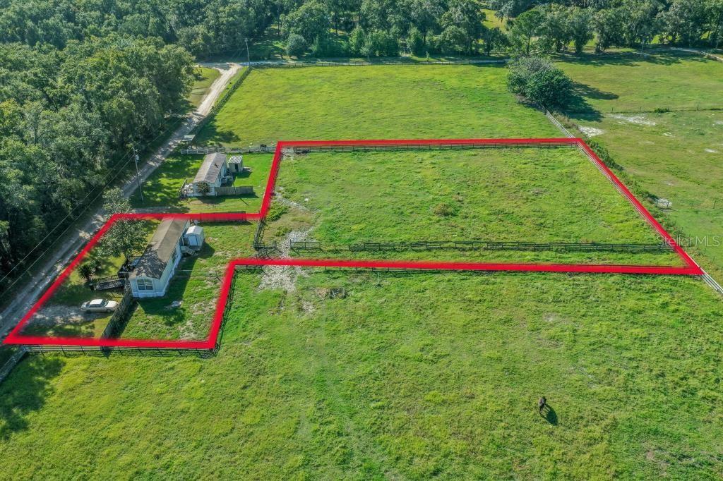 Bring your vision to life with this 1.22 acre agricultural zoned property tucked away in a quiet, peaceful area of horse country while only
approximately one mile off a paved road. Whether you’re looking for a starter home, a winter getaway while attending local horse shows, or an investment property, this property offers plenty of potential. With no HOA or deed restrictions, you have the freedom to explore the possibilities. Looking for even more space? There is an opportunity to purchase an additional 2.19 acres adjacent to this property for $159,900, contact the listing agent for additional information. Equestrian enthusiasts will appreciate the convenient location, just 7.2 miles from the World Equestrian Center and 12 miles from HITS. Enjoy the peaceful country setting while remaining close to two of Ocala’s premier equestrian destinations. Whether you’re looking for a place to call home, a seasonal retreat, or an investment opportunity, this property is full of possibilities! (Please Note: This property is also listed as a home for sale under MLS# OM734448.)