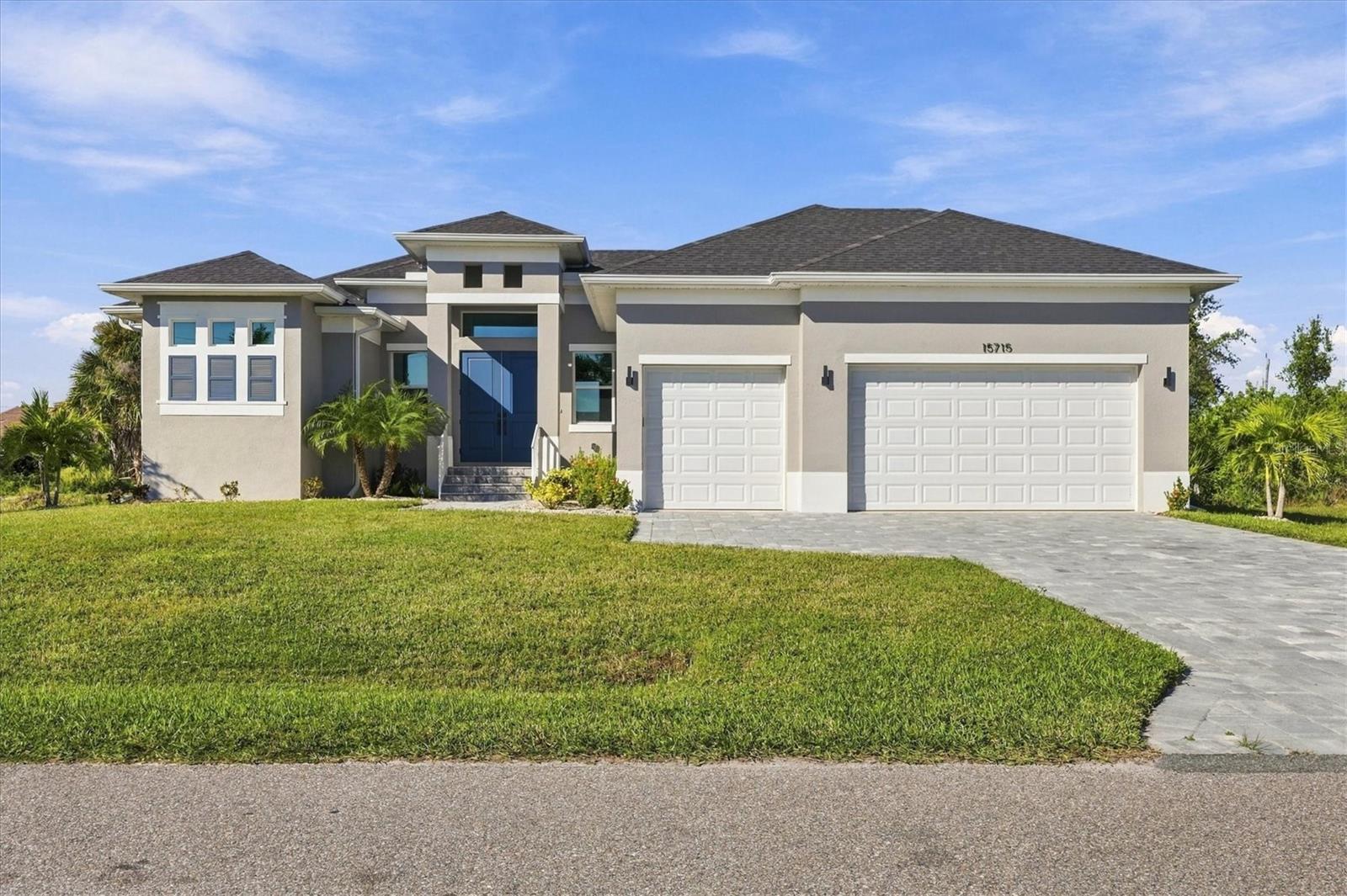 NEVER LIVED IN – NEW POOL & SPA HOME IN SOUTH GULF COVE! Completed in 2024 and never occupied, this 3-bedroom, 2-bath home with a 3-CAR GARAGE has just been upgraded with a brand-new heated saltwater pool and spa. Enjoy 1,961 sq ft of living space on a 0.23-acre lot. Step out back to your private retreat: a pebble-finish pool with heat pump, sun shelf and built-in bench, plus a raised 6x6 spa with 6 therapy jets and LED lighting, all controlled from the Jandy AquaLink automation system. A paver deck, 476 sq ft of covered lanai space and an aluminum fence around the sides and back of the home make it ideal for outdoor living and entertaining all year. Inside, the open floor plan features high ceilings, crown molding, ceramic tile throughout and ceiling fans. Impact windows throughout add peace of mind and energy efficiency. The kitchen offers quartz countertops, solid wood cabinets and stainless steel appliances. The primary suite includes a tray ceiling and walk-in closet. A large laundry room, paver driveway and irrigation system complete the package. Minutes from the South Gulf Cove boat ramp with access to Charlotte Harbor and the Gulf, and a short drive to Englewood Beach, Boca Grande, golf, shopping and dining. Optional HOA. Move-in ready. Schedule your showing today!
