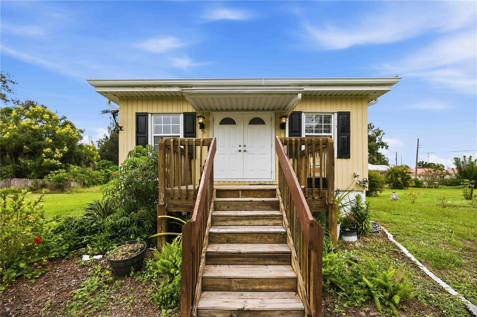Built in just 2010, this bungalow sits close to downtown Arcadia with easy access to Fort Myers, Punta Gorda, and Sarasota! This unique home is built with durable steel construction on a 3-foot concrete block stemwall. Featuring a great room layout with a flexible kitchen space ideal for a custom island or dining table, and a renovated and brand-new, tiled bathroom is one you won't want to miss! Enjoy mornings on the front porch and evenings on the full-width back porch, that comes with slider access form the primary bedroom. The private yard offers enough room for a carport, garage, or fire pit. Schedule your private tour today!