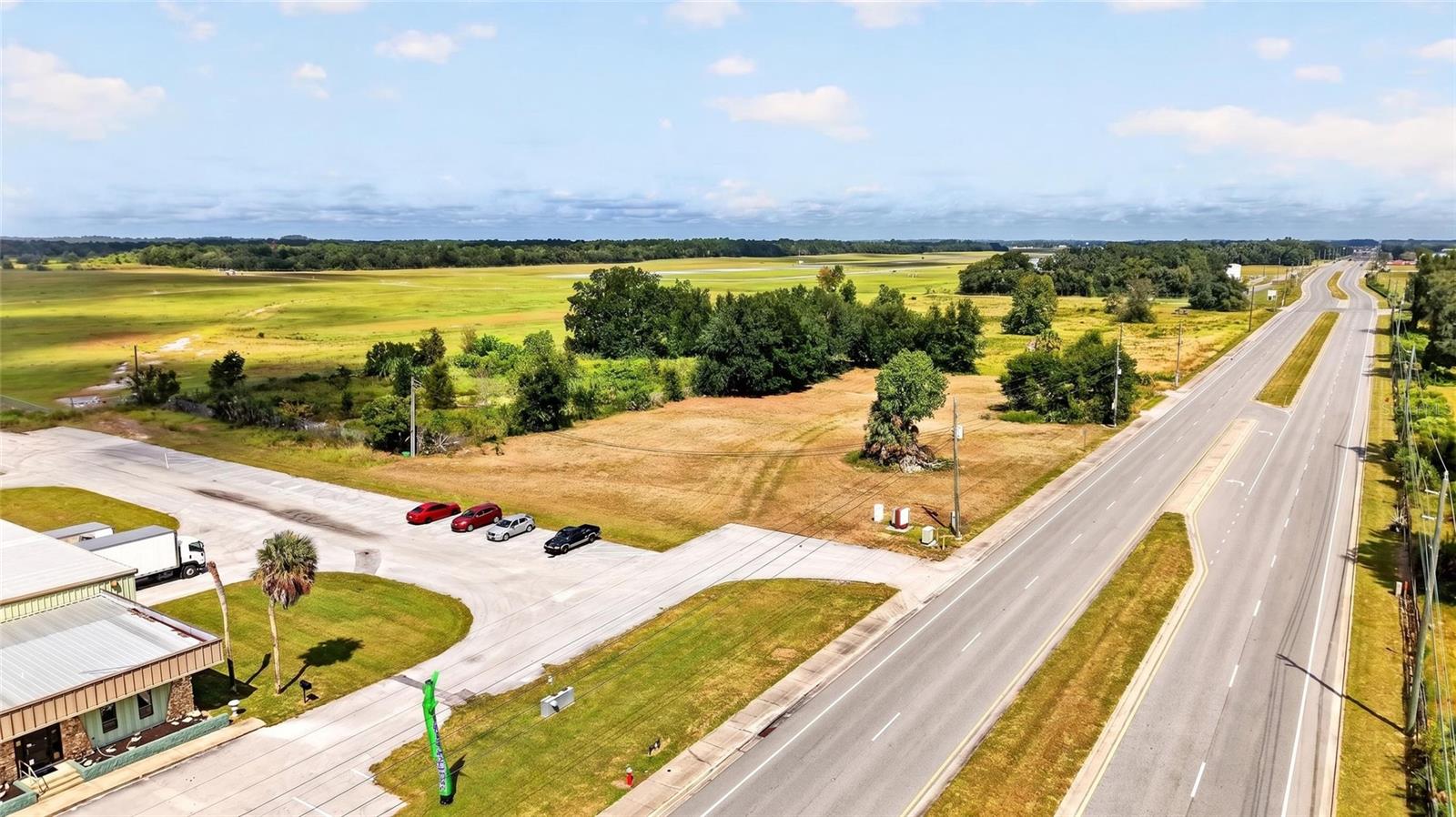 LAND OPPORTUNITY ADJACENT TO THE OCALA AIRPORT! Zoned M-1 with low intensity commercial use, this site is well- suited for a manufacturing facility, self storage, small to mid bay warehouses, and flex space. Listing includes 2.65 +/- industrial acres with 300'+ of road frontage along SW 60th Avenue in the heart of Ocala. Three separate parcels to convey: (Parcel IDs: 23820-015-01; 23820-015-02; and 23820-015-03) providing for easy future division and development if desired. Located just 6 miles to the World Equestrian Center; 7 miles to the Downtown Ocala Square; 2 miles south of Ocala Breeders' Sales; and just West of I-75, this centrally located vacant land offering brings a BIG opportunity for business and professional growth in Marion County!