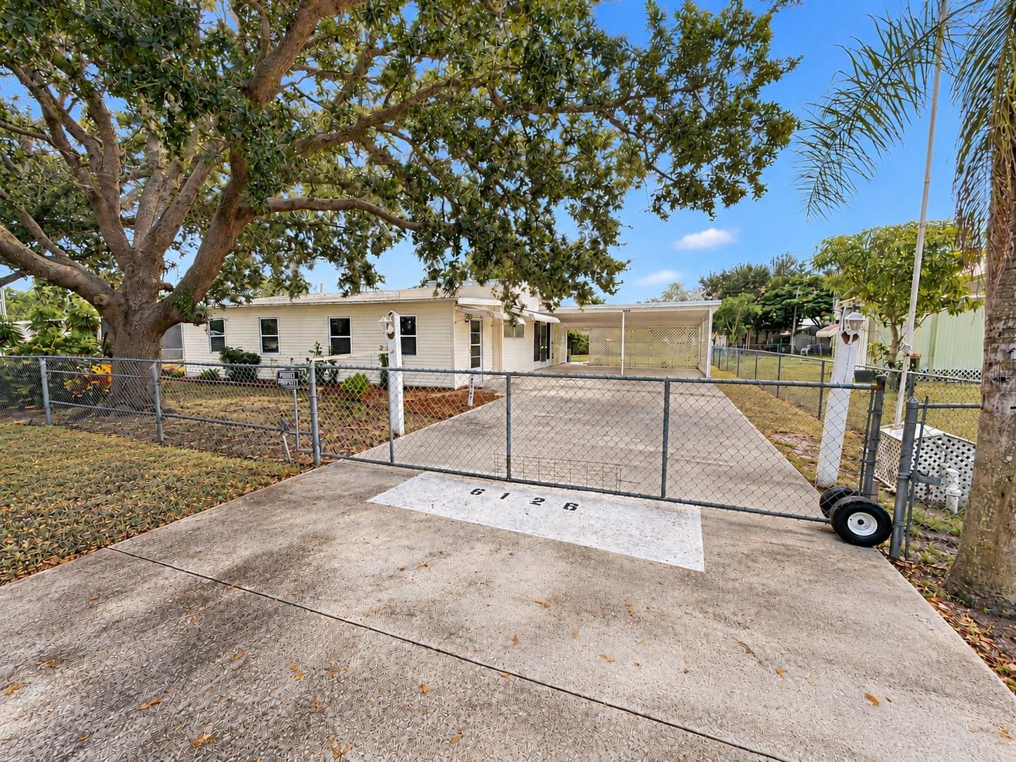 Welcome to this charming 2 bedroom, 1 bath home conveniently located in Punta Gorda, just minutes from downtown, I-75, shopping, dining, entertainment and Punta Gorda Airport! Situated in an area with NO HOA and outside of a designated flood zone, this property offers flexibility, convenience, and affordability. The home features luxury vinyl plank flooring throughout, an updated kitchen, and a comfortable floor plan designed for easy everyday living. The entire property is fully fenced with a gated driveway, providing added privacy and security. A spacious 2 car carport offers plenty of covered parking, while the 12' x 22' detached shed provides excellent additional storage space for tools, equipment, hobbies, or outdoor essentials. Whether you're looking for a full time residence, seasonal getaway, or investment opportunity, endless opportunities! Enjoy the convenience of being close to everything Punta Gorda has to offer while having the freedom of no HOA restrictions. Schedule your showing today and see the possibilities!