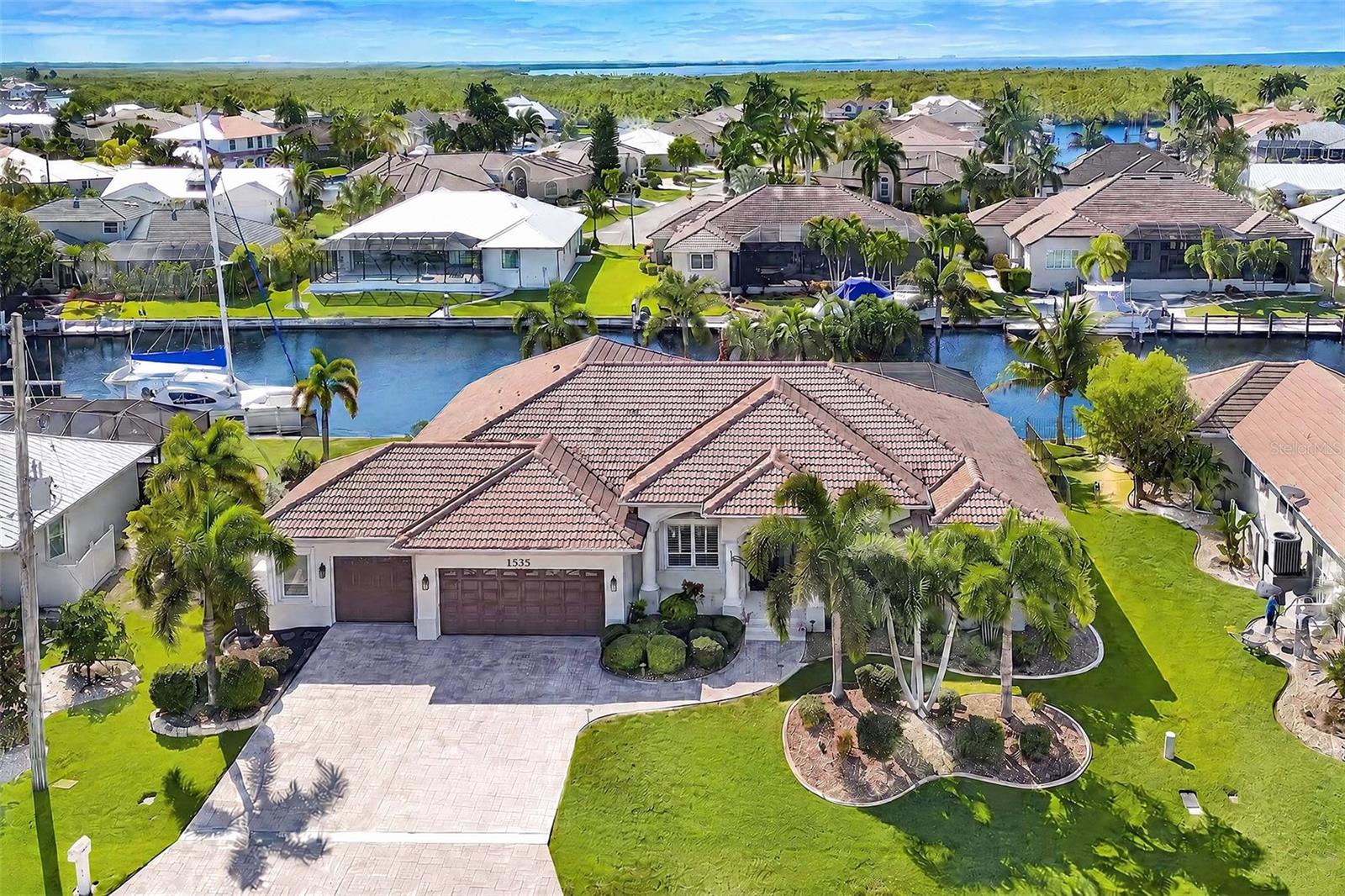 LOCATION. BOATING. FLORIDA LIFESTYLE. THIS ONE HAS IT ALL!

Welcome to 1535 Suzi Street in sought-after Punta Gorda Isles, where waterfront living, and the best of Southwest Florida come together! With over 3,100 square feet, 3 large bedrooms plus a den, an oversized 3+ car garage, and an impressive list of home improvements, this home delivers the space, features, and lifestyle you’ve been looking for.

Boaters, get ready! With over 100 feet of waterfront, two boat lifts—including a 10,000-pound boat lift and a separate 2,000-pound lift for your jet skis—and a quick 10-minute ride to open water in Charlotte Harbor, your days on the water are closer than ever. Spend the morning cruising, the afternoon lounging by your private pool and spa, and the evening enjoying everything Punta Gorda has available.

Inside, beautiful wood floors, a spacious open floor plan, and inviting gathering spaces make it easy to entertain, relax, and enjoy life with family and friends. Outside, the pool, spa, and waterfront setting create your own private Florida retreat.

And talk about LOCATION! Enjoy a bike ride to Fishermen’s Village for waterfront dining, shopping, entertainment, and that unmistakable Florida vacation vibe. Downtown Punta Gorda is another local favorite, with charming boutiques, fantastic restaurants, waterfront parks, and the kind of small-town charm that makes you fall in love with this area.

More than a home, this is the Florida lifestyle you came for. Bring the boat, fire up the spa, and get ready to live where every day feels like vacation.

Your Punta Gorda Isles waterfront lifestyle starts here!