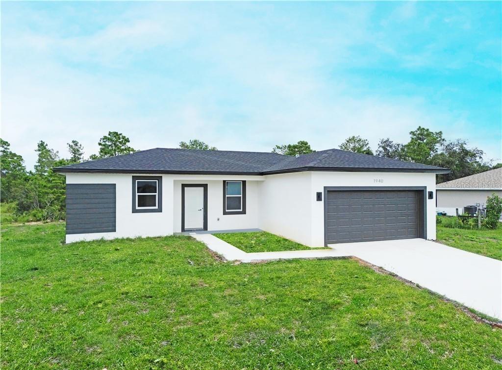Discover this stunning, move-in-ready new construction home offering 1,269 sq ft of living area located in the fastest-growing area of Sebring. Featuring a sleek contemporary layout with 10-foot ceilings and elegant laminate flooring throughout, this residence boasts 3 spacious bedrooms and 2 stylish bathrooms. Enjoy a gourmet kitchen with white cabinetry, quartz countertops in both the kitchen and bathrooms, and stainless steel appliances. Bathrooms feature frameless glass-enclosed showers and bathtubs, adding a luxurious touch. The open floor plan seamlessly connects living, dining, and kitchen areas, while the private backyard offers a peaceful retreat. Built with Stem Wall foundation for enhanced elevation and structural strength, this home also features impact-resistant windows and doors, automatic garage door, irrigation system, and high-end finishes throughout. This property is ideal for families, snowbirds, or investors. Plus, it includes a builder’s warranty 1-2 years and 10-year structural coverage offering peace of mind for years to come. Don’t miss this incredible opportunity to own a high-quality home in a booming location!-WITH SHELVES, FILTER AND BLINDS