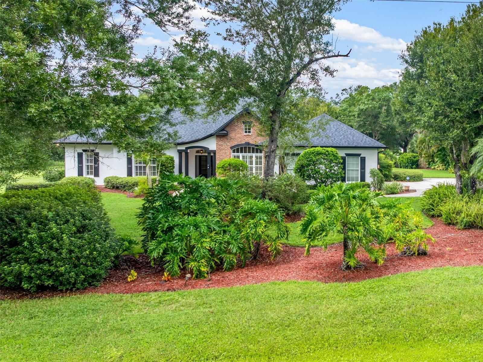 Welcome to this stunning custom-built pool home situated on a beautifully landscaped ONE-ACRE-PLUS LOT in the deed-restricted community of Sunnybreeze Oaks with NO HOA FEES, offering the perfect combination of privacy, space, comfort, and modern upgrades. From the moment you arrive along the long driveway, you’ll appreciate the lush landscaping and peaceful setting. With NO NEIGHBORS BEHIND YOU, the property backs up to Paradise Golf Course, creating a beautiful and private backdrop.

Inside, this spacious 3-bedroom, 2.5-bath home offers approximately 2,683 square feet of living space with high ceilings, tray ceilings, crown molding, chair railing, plantation shutters, and an inviting open layout. The beautifully updated kitchen is the heart of the home, featuring white cabinetry, stainless steel appliances, quartz countertops, and a striking waterfall-edge center island overlooking the dining area and family room—perfect for entertaining.

The generous primary suite provides a relaxing retreat with a custom-designed walk-in closet and spacious en suite bath featuring travertine tile, dual sinks, a garden tub, and large walk-in shower. Two additional bedrooms provide plenty of space for family or guests, along with a guest bath and updated powder room. The completely renovated interior laundry room features new cabinetry, flooring, and laundry appliances.

Step outside and discover your own PRIVATE FLORIDA OASIS! The newly added heated saltwater pool and spa are surrounded by a panoramic screen enclosure and overlook the beautiful backyard and golf course beyond. New sod and a new rear-yard irrigation/sprinkler system further enhance the outdoor space, creating a peaceful setting to relax, entertain, and enjoy the Florida lifestyle.

Energy efficiency is another outstanding feature. The PAID SOLAR SYSTEM has been upgraded with additional panels and Tesla Powerwalls, providing exceptional energy independence and significantly reduced electric usage.

Additional improvements include a 2019 ROOF, water system replaced in 2021, MAIN A/C SYSTEM REPLACED IN 2025, BEDROOM A/C SYSTEM REPLACED IN 2026, luxury vinyl plank flooring, quality bedroom carpeting, professional interior and exterior paint, and a newly finished garage floor. The septic system has also been recently pumped and inspected.

Conveniently located near Punta Gorda airport, Port Charlotte, I-75, golf, shopping, dining, and Southwest Florida amenities, this exceptional property gives you the space and privacy of country-style living while keeping you close to everything. Make sure to view the 3D Tour and Virtual Tour attached.