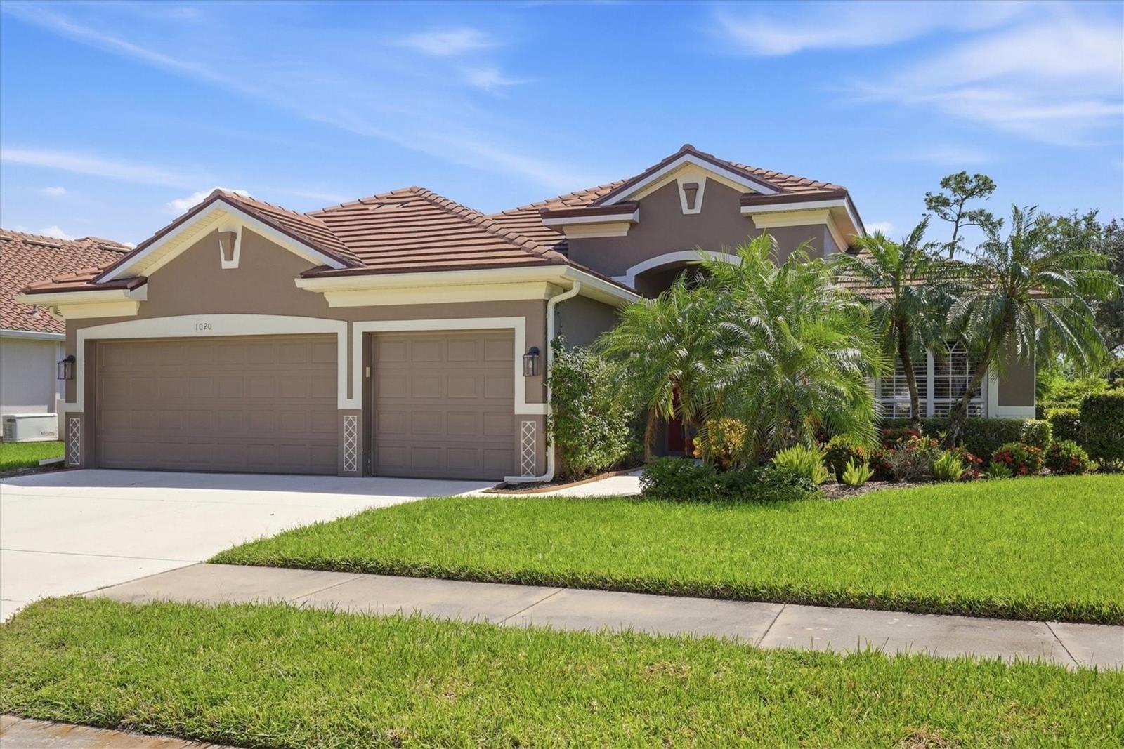 This is the Heron Creek home you don’t have to remodel. Extensively redesigned and beautifully updated, this Estate Series home offers more than 2,400 sq. ft. under air, a heated pool and spa, expanded lanai, 3-car garage and an open view across Creek #8 while still providing privacy. The renovation went well beyond finishes—the floor plan itself was reworked to create a more open, comfortable home.
Engineered wood flooring runs through the main living areas, complemented by solid-core Shaker doors, updated trim and custom closet systems. At the center of the home is a completely redesigned kitchen with a large island, striking natural-stone countertops, Shaker cabinetry, dry bar, stainless appliances, natural-gas cooking and two pantries. It opens to the great room and dining area, while large sliding glass doors bring in abundant natural light and extend the living space outdoors.
The former fourth bedroom and formal living room were combined to create an impressive 14' x 24' activity room, currently enjoyed as a billiards room but equally suited for a home office, fitness room, media space or additional guest accommodations. The split-bedroom layout provides privacy for guests, while the primary suite features tray ceilings, motorized window treatments, two walk-in closets with custom built-ins and a completely rebuilt ensuite bath. The guest bath was also renovated from the studs with quality tile and fixtures.
Florida living is where this home really delivers. The lanai was substantially expanded and finished with non-slip travertine surrounding the heated pool and spa. Panoramic screening preserves a golf-course view while the greenbelt offeres privacy.
The expensive work has already been addressed: new roof, 25KW Generac whole-house generator, wind-rated garage doors, 2022 HVAC and water heater, and 2024 pool heater. The home’s plumbing has been rerouted from beneath the concrete slab through the attic, providing easy access for future maintenance or repairs. The 3-car garage is wired for EV charging and offers ample cabinetry and workshop space in addition to vehicle parking. A list of upgrades and improvements is attached. Located in Flood Zone X.
Heron Creek Golf & Country Club is one of North Port’s established gated golf communities, offering 27 holes of Arthur Hills-designed championship golf, clubhouse dining, fitness center, tennis, resort-style pool and spa, and an active social calendar. Membership is required and several tiers are available. HOA services include lawn care, trimming, mulching, irrigation, cable, high-speed internet and gated entry. No CDD.
The location makes everyday life easy, too. Heron Creek is convenient to both US-41 and I-75, with shopping, dining and medical services nearby. Downtown Wellen, CoolToday Park, Costco and the growing Wellen Park area are within easy reach, while Gulf beaches, Venice and Punta Gorda make for easy day trips. For those who prefer trails to tee times, nearby Myakkahatchee Creek Environmental Park offers another side of Southwest Florida living.
Beautifully renovated, thoughtfully redesigned and exceptionally well equipped—1020 Creek Nine offers the benefits of an established Heron Creek home without a renovation list. Furniture package available separately.