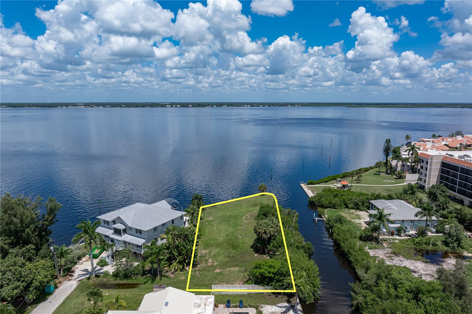337 FT OF WATERFRONT W/DIRECT PEACE RIVER FRONTAGE & PANORAMIC WATER VIEWS! Rare opportunity to build your custom waterfront home on this oversized 0.40-acre (17,522 sq ft) vacant lot in Punta Gorda. Surrounded by water on two sides, the property boasts approximately 337 FT OF CONCRETE SEAWALL including 96 ft directly along the Peace River plus an additional 241 ft of canal frontage. Few properties offer this combination of lot size, waterfrontage & spectacular open-water views. The northern exposure provides sweeping views across the Peace River from northeast to northwest. Picture designing your future home to take full advantage of the exceptional water views with the river creating a dramatic backdrop from your main living areas & outdoor entertaining spaces. Northwest views offer the added bonus of colorful summer sunsets over the water as the setting sun tracks farther north during the warmer months. Boaters will appreciate having direct access to the Peace River from their backyard. Head south along the river, travel beneath the Barron Collier/US-41 Bridge & continue toward Charlotte Harbor and beyond. Whether you're heading out for a day of fishing, cruising to a waterfront restaurant or simply enjoying an afternoon on the water, your next adventure can begin right outside your back door. With 17,522+/- sq ft, the oversized lot provides an exceptional canvas for designing a custom Florida waterfront home. Create the outdoor living space you've imagined while taking advantage of the tremendous waterfrontage and panoramic river views. Public water is available; septic is needed. NO HOA & NO DEED RESTRICTIONS. Property is conveniently located between the I-75 and Barron Collier/US-41 bridges, putting historic downtown Punta Gorda's dining, shopping, waterfront parks & year-round events within easy reach while maintaining an impressive waterfront setting. Quick access to I-75 makes traveling north or south throughout Southwest Florida simple. BUILD YOUR FLORIDA DREAM HOME HERE & START ENJOYING THE WATERFRONT LIFESTYLE PUNTA GORDA IS KNOWN FOR!