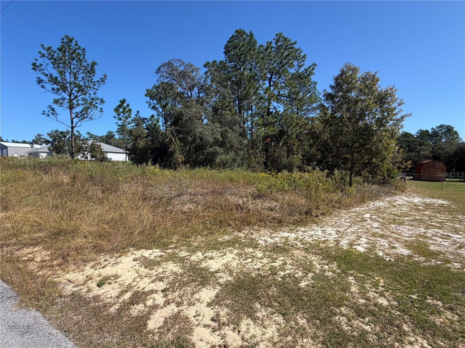 Discover the perfect opportunity to build your dream home or invest for the future in Rainbow Lakes Estates! This spacious 0.99-acre lot (approximately 134' x 321') offers plenty of room to enjoy the Florida lifestyle with NO HOA fees! Rainbow Lakes Estates features three lakes and a community park, providing opportunities for outdoor recreation and relaxation. Conveniently located just a short drive from Dunnellon, where you'll find shopping, dining, medical facilities, Walmart, Publix, Tractor Supply, and more. Enjoy nearby access to the beautiful Rainbow and Withlacoochee Rivers, known for boating, fishing, kayaking, and other outdoor activities. Build now or invest for the future!