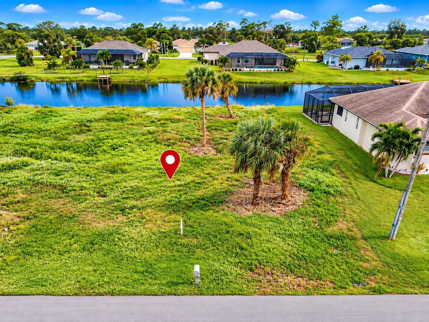 Build your dream home at 165 Tournament Road! This clear, buildable 80-by-120-foot lot offers desirable western rear exposure—perfect for a future pool and enjoying beautiful Florida sunsets. The property features a peaceful canal view.  Don’t miss this excellent opportunity to create your ideal Florida home!