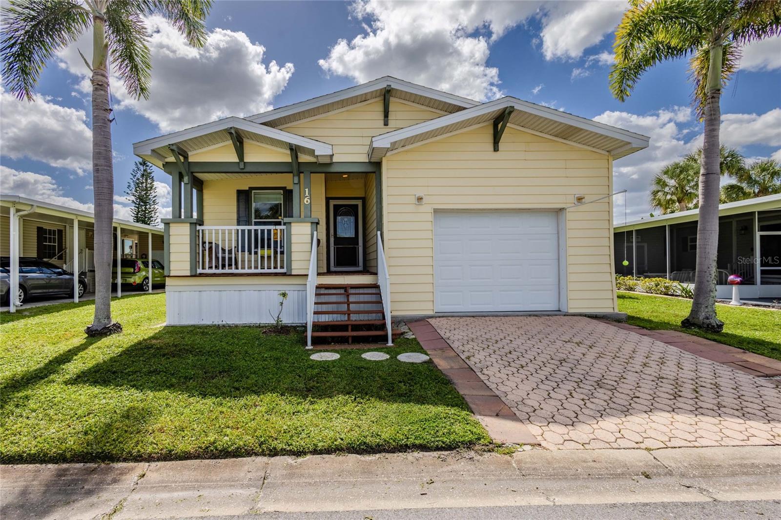 WATERFRONT PERFECTION & PARK-LIKE SERENITY AWAITS! 
 A True Gem with Panoramic Views! and garage !
Step into luxury and embrace the Florida lifestyle in this stunning 2-bedroom, 2-bathroom home nestled in the award-winning, resident-owned community of Maple Leaf Golf & Country Club! From the moment you arrive, you will be captivated by the breathtaking, unobstructed panoramic views of the tranquil lake and lush greenbelt. Enjoy your mornings with a stunning sunrise and unwind in the evenings with spectacular sunset skies right from your private back porch! Surrounded by mature, picturesque landscaping, this home offers a true park-like setting for ultimate peace and relaxation. Property Highlights & Features:
Light, Bright & Gleaming: Step inside to an airy, open-concept floor plan illuminated by abundant natural light and gorgeous flooring throughout.Versatile Bonus Room: Endless possibilities! Use it as a home office, creative craft room, cozy guest room, or a serene sitting area to suit your lifestyle.Dual Porches: Enjoy gentle breezes and outdoor living year-round with both front and back  porches.
Convenient Parking: Features an attached garage for effortless parking and storage.
Move-In Ready & Certificate-Owned: A community-owned, certificate-conveying property ready for you to call home! Furnished .
Live the Resort Lifestyle Year-Round or Seasonally!
Located in premier Maple Leaf Estates, you are golf cart ride away from incredible, top-tier community amenities:
Championship 18-Hole Golf Course & Pro Shop
4 Heated Swimming Pools & 2 Hot Tubs 5 Tennis Courts, Pickleball, Bocce Ball, & Lawn Bowling State-of-the-Art Fitness Center, Woodworking Shop, & Pottery Studio On-Site Restaurant & Full-Service Tiki Bar Over 75+ Active Social Clubs, Activities, & Community Events  Don't Miss Out on This Rare Waterfront Find! Whether you are looking for a seasonal winter getaway or a permanent year-round paradise, this exceptional home delivers comfort, style, and unmatched views.Call today to schedule your exclusive showing!







5 Tennis Courts, Pickleball, Bocce Ball, & Lawn Bowling

State-of-the-Art Fitness Center, Woodworking Shop, & Pottery Studio

On-Site Restaurant & Full-Service Tiki Bar

Over 75+ Active Social Clubs, Activities, & Community Events

?? Don't Miss Out on This Rare Waterfront Find!
Whether you are looking for a seasonal winter getaway or a permanent year-round paradise, this exceptional home delivers comfort, style, and unmatched views.

Call today to schedule your exclusive showing!