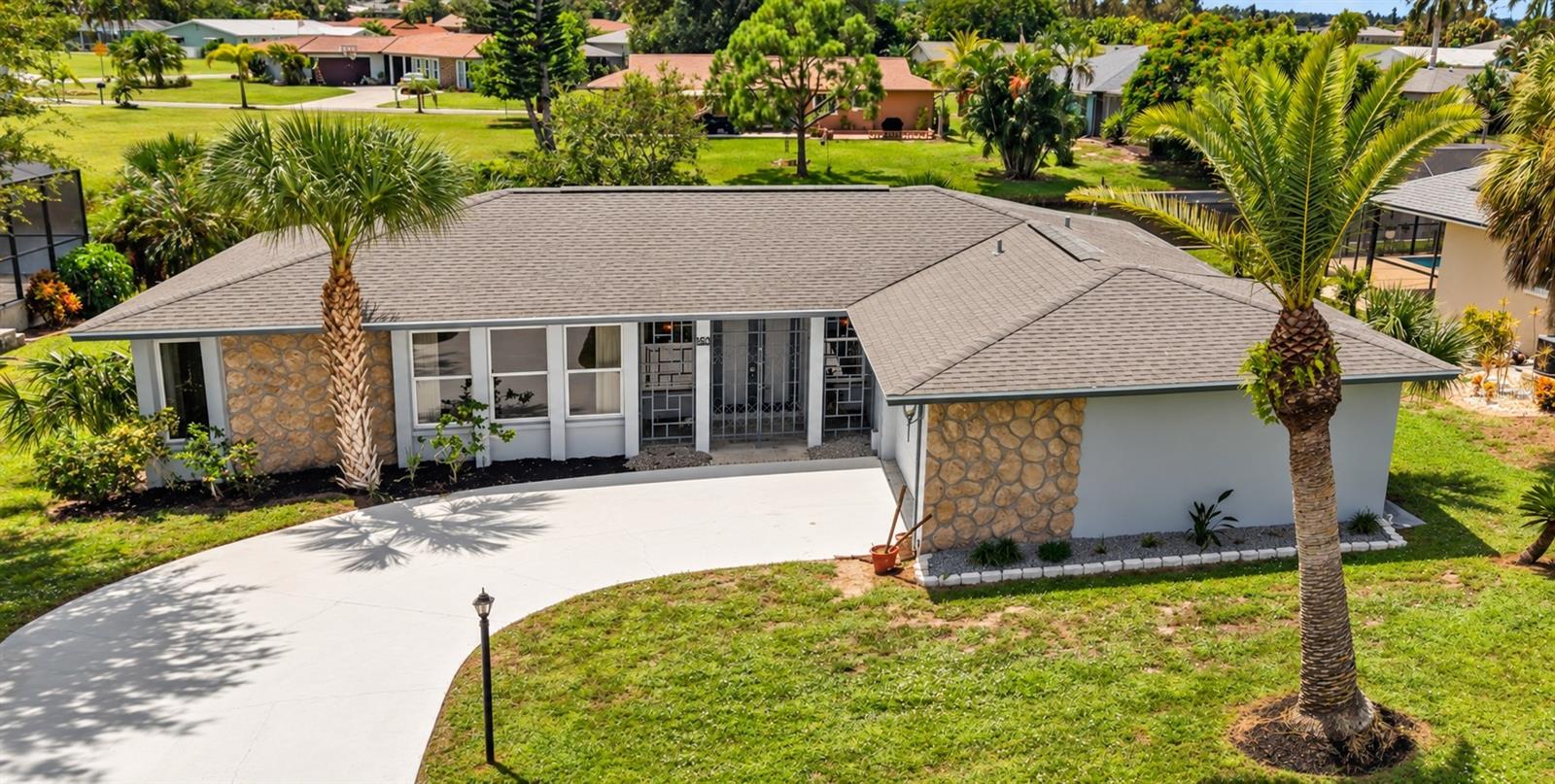 BRAND NEW 2026 ROOF!!! ** WATERFRONT HAVEN WITH CURB APPEAL IN ROTONDA WEST ** DO NOT MISS!!! From the moment you pull up the sweeping, expansive driveway, this property captivates with undeniable Florida charm. Step onto the stone pathway and pass through an artistic, open-air decorative gate that reveals a private, tranquil front courtyard. Double entry doors give more architectural design that seamlessly blends the unique style of this spacious waterfront 3-bedroom, 2-bath home offering 1,777 square feet of living space on a beautiful canal setting, in the Oakland Hills of Rotonda West. The welcoming oversized Foyer almost stretches the length of the house, and you'll appreciate the generous living areas and easy-flowing floor plan within, along with multiple views of the waterfront as you pass through. This home offers a great opportunity of easy living and at the price, the ability to update it to your own style. The primary bedroom and back bedroom showcase waterfront canal views with sliders that allow for easy access to the backyard. That's where the Florida lifestyle really comes into focus. Enjoy beautiful sunsets and your own waterfront backdrop, whether you're relaxing with your morning coffee, entertaining friends or simply unwinding at the end of the day.  An attached 2-car garage provides additional parking, laundry area and storage.  Located in established Rotonda West, you're close to golf, boating, fishing, beaches, shopping and dining, with Englewood Beach and Boca Grande within easy reach. If you've been searching for a waterfront home with HURRICANE ACCORDIAN SHUTTER PROTECTION ** IMPACT WINDOWS... With TLC... At this price point there is room to make it your own, 160 Annapolis Lane deserves a closer look. Come see the potential and stay for the water view. Use showing time or call for showings. This is an outstanding opportunity to own a canal-front home in Rotonda West. HVAC 2009, ROOF 2026, WATER HEATER 2013,  Take a look today!  Easy to show!