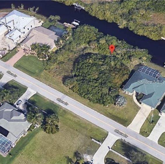Vacant residential lot in Port Charlotte with 80 ft of frontage — ready for your new build. Public water and sewer available. The canal connects directly to Charlotte Harbor with no bridges to go under, so larger boats are welcome. Convenient to US-41, shopping, dining, and Gulf beaches. Listing agent is related to the seller
