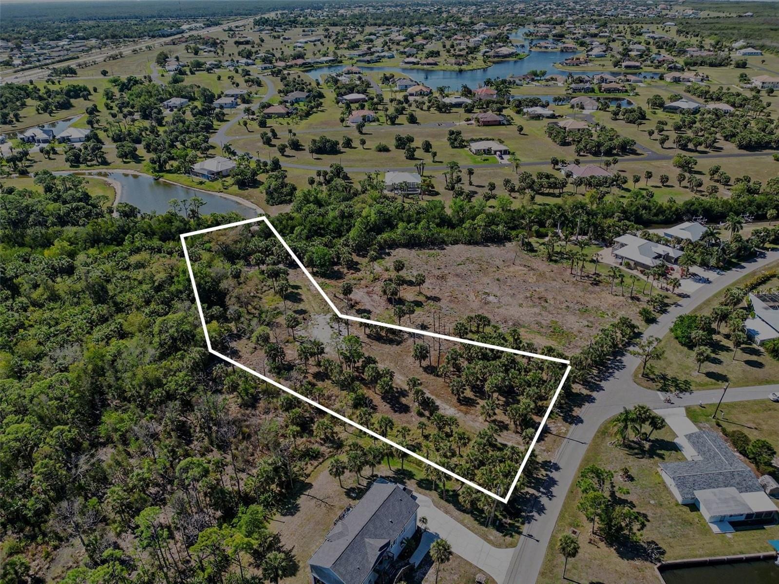 "Wake up to open water possibilities on 1.64 acres of rare gulf-access piece of paradise in Pirate Harbor, just a straight run to Charlotte Harbor and the Gulf. With hundreds of feet of tranquil canal frontage, your private dock, tiki hut, and waterside patio set the stage for sunset dinners, early morning fishing, and effortless days on the water. Build the coastal estate you've always imagined or a retreat that feels worlds away yet just minutes from Punta Gorda's charm. This isn't just a homesite it's your gateway to a life defined by freedom, beauty, and the rhythm of the Gulf."