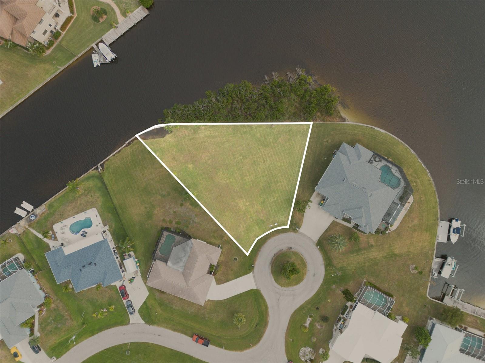 Builder-Ready Waterfront Lot in Prime Port Charlotte Location with High-Growth Opportunity. Over 200 feet of water-frontage. Survey available. Fantastic opportunity for builders, or bring your own builder. Discover a rare opportunity to secure a build-ready waterfront parcel in Port Charlotte, a high-growth, desirable market with tremendous upside. This exceptional lot offers direct access to the Gulf of Mexico through the Myakka River making it a perfect canvas for your custom dream home or investment property. Nestled in a stable and expanding community, the setting combines peaceful waterside living with convenient access to local amenities, shopping, dining, and recreation. With your vision and the right design, this lot can deliver waterfront lifestyle and long-term value. Don’t miss your chance parcels like this don’t come along often.