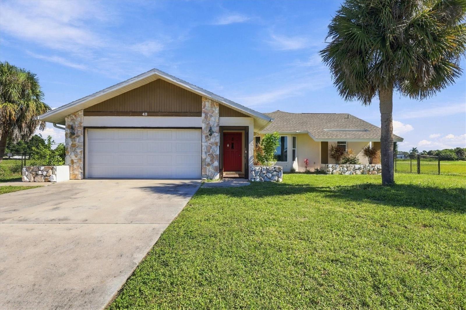 This 2-bedroom, 2-bathroom split floor plan home in Rotonda West offers comfortable living with plenty of space to enjoy. The main living area features a VAULTED CEILING, adding volume and an airy feel. The home includes both a LIVING ROOM and a FAMILY ROOM, providing flexibility for everyday living and entertaining. The kitchen, family room, and covered back patio OVERLOOK A TRANQUIL POND AND GOLF COURSE, creating a peaceful outdoor retreat with serene views. Both bedrooms feature LARGE WALK-IN CLOSETS, and the home includes an INTERIOR LAUNDRY ROOM for added convenience. TILE FLOORING THROUGHOUT offers easy maintenance and a clean, cohesive look. A NEW ROOF and IMPACT WINDOWS installed in 2021 add long-term value, storm protection, and peace of mind. The home also includes a two-car garage, covered front entry, and fenced backyard perfect for pets, gardening, or play. Situated along the Pinemoor Golf Course, one of Rotonda West's five public courses, you'll enjoy easy access to golf, nearby parks and tennis courts, and miles of scenic walking and biking paths. Beaches, dining, and shopping are just minutes away. This property is located in a FEMA ZONE X, the preferred low-risk flood zone where flood insurance is not required by lenders, a valuable advantage in coastal Florida. Priced to reflect deferred maintenance and repair needs, this property presents an excellent opportunity for investors, cash buyers, or anyone looking to personalize a home in a highly desirable community.