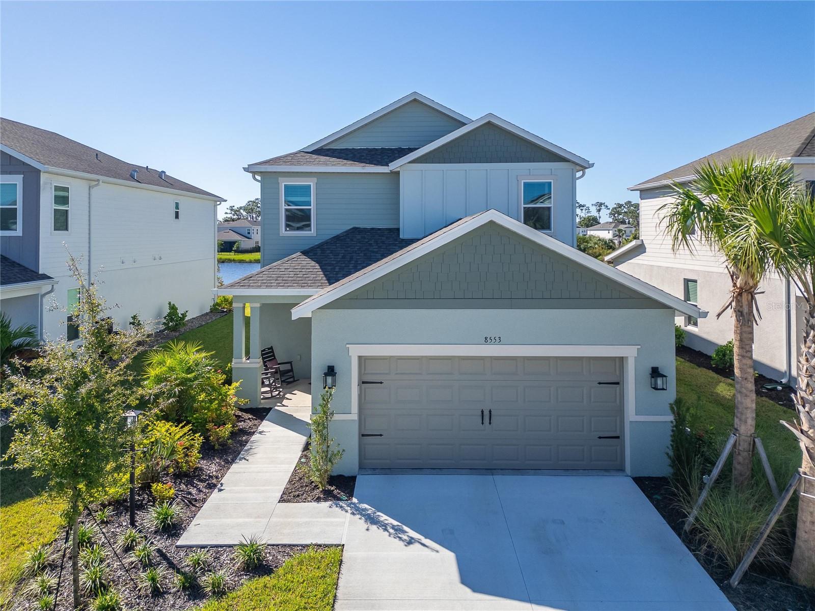 LUXURY AT ITS FINEST! Why wait to build when you can enjoy the upgrades, pool, and pond view you've been dreaming of—all in one beautifully finished home. Located on a premium pond-view homesite in Cassia at Skye Ranch, this impressive Taylor Morrison Anastasia model offers 4 bedrooms, 3 ½ bathrooms, a private study, game room, loft, and a 2-car garage. Enjoy total peace of mind with whole-house impact windows and doors, complemented by extensive high-end upgrades throughout. Seller is offering the buyer a First American Home Warranty at closing, providing additional valuable coverage for eligible covered home systems and appliances. 

The gourmet kitchen is a true standout, featuring 42-inch upper cabinetry with soft-close doors and drawers, a modern chevron backsplash, under-cabinet LED lighting, and Silestone quartz countertops with breakfast-bar seating. GE Café stainless steel appliances, a designer hood vented to the exterior, and thoughtful storage upgrades complete this inviting space. The kitchen flows seamlessly into the open-concept family and dining rooms, offering an unobstructed view of the pool and the peaceful pond beyond. Step through the dramatic pocket sliding glass doors into your private outdoor retreat. Here, a heated saltwater pool, expansive paver deck, and a panoramic screened enclosure create an inviting oasis for relaxation or entertainment.

Located on the main floor, the primary suite is a serene getaway showcasing peaceful pond views and a spacious walk-in closet. The luxurious ensuite bath features double vanities, quartz countertops, and elegant matte-black fixtures. The primary shower elevates the spa experience with a rain showerhead, stunning floor-to-ceiling tile, and a glass enclosure. The main floor is finished with luxury vinyl plank flooring, five-inch baseboards, and eight-foot interior doors throughout.

Upstairs, a beautiful wrought-iron spindle staircase opens to a generous game room—perfect for a secondary living space, movie nights, or lounging. A separate loft space adds extra versatility for a home office or play area. This floor accommodates three additional bedrooms, including one with an ensuite bath. To match the home's high-end feel, the upstairs bathrooms are fully upgraded with premium cabinetry, quartz countertops, designer tile, and sleek matte-black fixtures. Throughout the second level, you'll find quality finishes including five-inch baseboards, eight-foot doors, and plush carpeting.

Enjoy the Skye Ranch lifestyle with community amenities including a resort-style pool, junior Olympic lap pool, splash pad, hot tub, fitness facilities, indoor basketball courts, a rock-climbing wall, café, sports courts, parks, playgrounds, scenic trails and a fishing pier. Planned future amenities include a lazy river and waterslides. 

Skip the construction timeline, the upgrade-selection process, and the wait for a pool. Enjoy the finished home, the pond view, and the Florida lifestyle from day one! Don’t miss the opportunity to make this exceptional home yours. Be sure to explore the 3D tour, floor plan, and video for an even closer look.