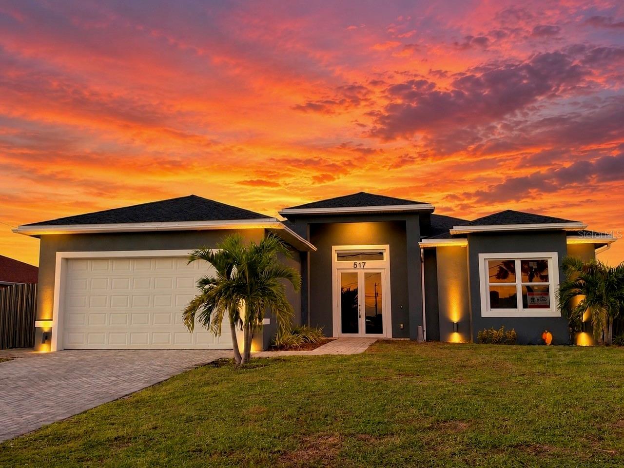 WATERFRONT LIVING PRICED TO SELL! This like new construction, 2 year old, stunning luxury 4-bedroom, 3-bathroom Cape Coral home blends elegant finishes  with inviting indoor and outdoor living spaces. Soaring ceilings create an airy atmosphere, while custom cabinetry, premium appliances, designer ceiling fans, and thoughtfully selected doors, windows, and fixtures add sophistication throughout. Bathrooms feature striking floor-to-ceiling porcelain tile for a luxurious finish.

Step outside to an expansive lanai with built-in cabinetry, ideal for entertaining or relaxing while enjoying the waterfront setting. The fenced backyard backs onto a canal, offering opportunities for fishing and kayaking right from your own property. Whether hosting guests or unwinding after a long day, this home offers the Florida lifestyle you’ve been looking for. Schedule your private showing today!