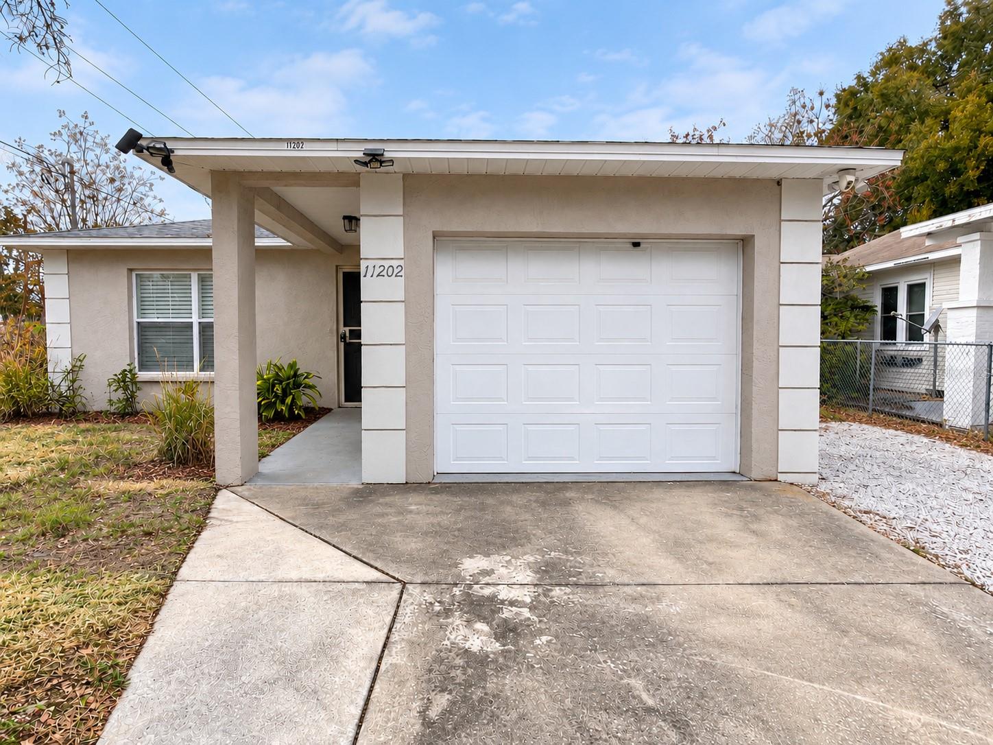 NORTH TAMPA CORNER-LOT HOME WITH BLOCK CONSTRUCTION AND NO HOA. Built in 2001, this 3-bedroom, 2-bath residence offers first-time home buyers an affordable opportunity to own a well-maintained home and build equity. The practical layout, attached 1-car garage and spacious fenced backyard provide comfort, convenience and room to grow. Fresh interior paint creates a clean, inviting atmosphere, while the kitchen features granite countertops, stainless steel appliances and updated cabinetry. Laminate flooring extends throughout the home for a cohesive look and easy maintenance. The roof was replaced in 2022 and the AC in 2020. Enjoy outdoor entertaining, gardening or relaxing in the private backyard. Conveniently located near USF, medical facilities, Busch Gardens, shopping and dining, with easy access to I-275 and I-75. For investors, the property’s desirable location, no-HOA setting and practical features strong rental or long-term investment potential. Schedule your private showing today.