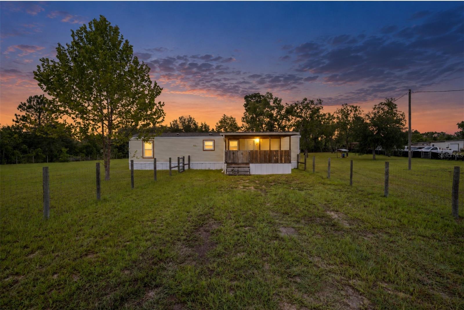 Move-in ready and beautifully renovated, this charming 2-bedroom, 1-bath home offers comfortable country living on 1.00 fully fenced acres. The property features approximately 780 square feet of living space and 1,080 total square feet, including inviting covered front and rear porches.

Inside, the bright, open layout creates a comfortable flow between the living area and kitchen. The updated kitchen features soft-close cabinetry, stainless-steel appliances installed in May 2024, and a convenient breakfast bar that provides additional seating and workspace. Luxury vinyl plank flooring extends throughout the main living areas, while both bedrooms feature newer carpeting. The renovated bathroom, updated interior doors, ceiling fans, light fixtures, window blinds, and neutral finishes complete the refreshed interior.

Many of the home’s major components have already been updated, including a new roof and 2-ton HVAC system installed in March 2024 and energy-efficient windows installed in 2025. Gutters have also been added for additional exterior protection.

Enjoy peaceful mornings on the covered front porch or relax and entertain on the spacious, screened-in back porch. The rear porch features a pan roof that also helps protect the back entrance and HVAC equipment. Outside, the fenced property provides ample usable space and includes a metal storage shed equipped with electricity.

Situated in a quiet rural setting, this thoughtfully updated property combines privacy, acreage, storage, and numerous major improvements—all ready for its next owner.