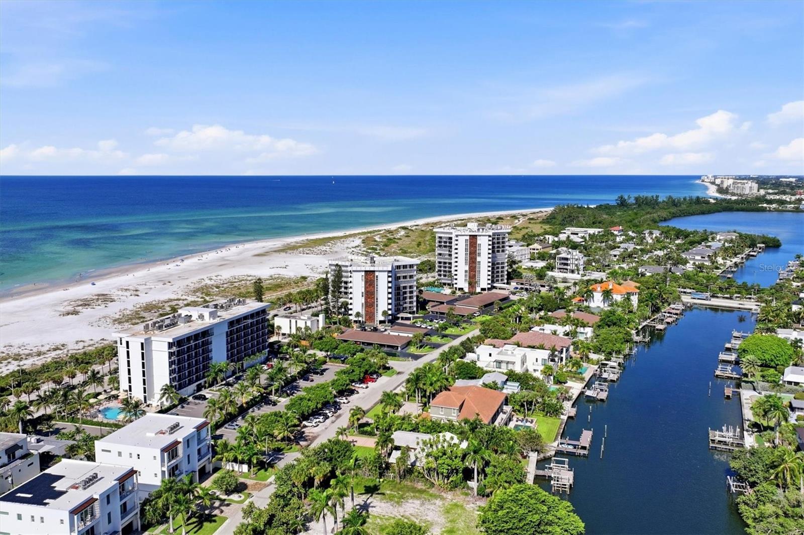 ELEVATED COASTAL LIVING ON PRESTIGIOUS LIDO KEY! Discover the perfect blend of coastal sophistication, modern comfort, and an exceptional location in this beautifully updated ninth-floor residence at St. Armands Tower South, directly across from the pristine white sands and turquoise waters of the Gulf of Mexico.

Offering 1,275 square feet of thoughtfully designed living space, this two-bedroom, two-bath condominium features an impressive collection of recent improvements, including new hurricane-impact-resistant exterior windows and doors, a new HVAC system, new appliances, and beautiful new flooring. These significant upgrades enhance the residence's comfort, functionality, and timeless appeal.

Step inside to discover a bright, inviting interior featuring an open living and dining area, abundant natural light, and a thoughtfully designed galley-style kitchen. Expansive sliding glass doors lead to a private balcony, where you can relax and enjoy captivating city views complemented by partial views of Sarasota Bay. From the ninth floor, the surrounding skyline provides a picturesque backdrop for morning coffee or evening relaxation.
Just minutes away, world-renowned St. Armands Circle features an exceptional selection of upscale boutiques, sidewalk cafés, and acclaimed restaurants. Downtown Sarasota, with its vibrant arts scene, theaters, galleries, waterfront dining, and cultural attractions, is conveniently accessible across the scenic John Ringling Causeway.

Whether you're seeking an elegant seasonal retreat or a sophisticated year-round residence, this beautifully updated ninth-floor condominium offers an extraordinary opportunity to enjoy one of Sarasota's most coveted coastal destinations.
