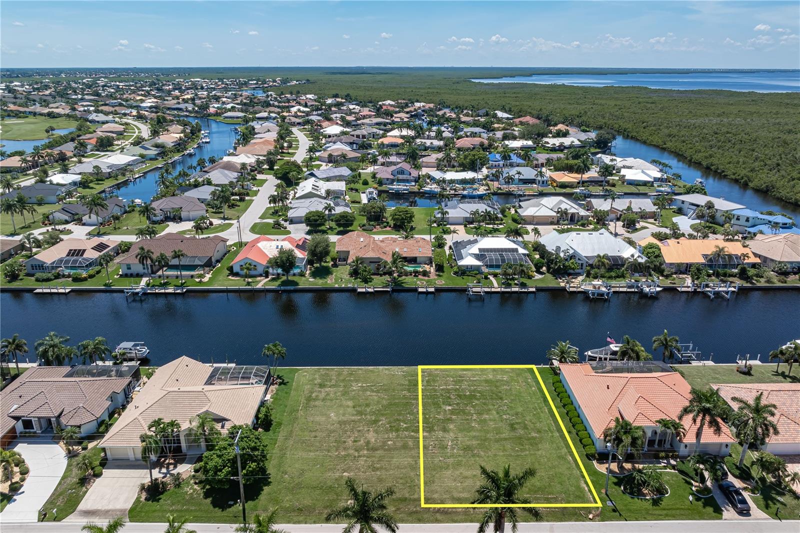 BUILD NOW OR BUY AS AN INVESTMENT! Looking for vacant waterfront property in Punta Gorda Isles? Consider this 80x120x80x120 lot w/80 FT OF WATER FRONTAGE & SAILBOAT ACCESS TO CHARLOTTE HARBOR. The standard 80x120 lot dimensions accommodate the popular model home designs offered by area builders, giving you plenty of options when choosing the right floor plan for your future home. Build now & customize it to fit your lifestyle OR purchase the lot today & hold for the future as vacant waterfront property in PGI becomes increasingly rare. Boaters will appreciate having TWO OPTIONS for reaching Charlotte Harbor. Head out through Buckley's Pass or cruise the perimeter canal to Ponce Outlet. Keep your future boat docked right in your backyard & set off whenever the mood strikes. Spend the day fishing Charlotte Harbor, head out toward the Gulf or take the boat to one of the area's waterfront restaurants. This is the lifestyle that makes Punta Gorda Isles such a popular choice for boaters. The neighborhood features a mix of established homes & newer, custom-built properties. Design a home that fits the way you want to live w/a pool, lanai & outdoor living area overlooking the canal. St Andrews South Golf Club is nearby, so you can play a round in the morning & still have plenty of time to get out on the water in the afternoon. Miles of sidewalks throughout PGI also connect you to area parks, Fishermen's Village & historic downtown Punta Gorda. The adjacent waterfront lot (#13) is available for sale separately, providing even more possibilities. Purchase both for approximately 160 FT OF WATER FRONTAGE & build across the two lots OR build on one & keep the neighboring lot open for additional privacy while holding it as a separate investment. Public water & sewer are available. Whether your plans include building right away or investing in waterfront property for the future, don't miss the opportunity to own in Punta Gorda Isles. Start planning your Florida dream today!