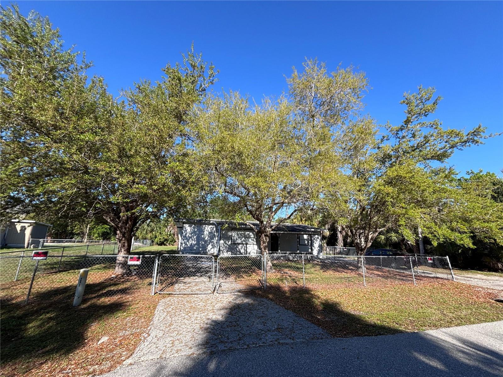 This beautifully refreshed 4-bedroom, 2-bathroom home in Punta Gorda offers the perfect combination of modern finishes, comfortable living, and Florida charm. Step inside and you'll immediately appreciate the updated wood-look tile plank flooring that flows throughout, creating a stylish, cohesive look that's both attractive and easy to maintain. The updated kitchen features granite countertops, refreshed cabinetry, and a welcoming space for preparing meals and gathering with family and friends. Both bathrooms have been tastefully updated, adding to the home's move-in-ready appeal. With four generously sized bedrooms, there's plenty of flexibility for a growing household, visiting guests, a home office, or whatever suits your lifestyle. Outside, the approximately 0.22-acre lot provides room for backyard barbecues, gardening, pets, or simply relaxing in the Florida sunshine. And the location makes it even better! Just minutes from historic downtown Punta Gorda, you'll enjoy waterfront dining, boutique shopping, Harborwalk along Charlotte Harbor, and easy access to boating, fishing, golf, and Gulf Coast beaches. Convenient access to major roadways and Punta Gorda Airport makes getting around a breeze. Whether you're a first-time homebuyer looking for an updated home without the hassle of major renovations, a growing household needing extra space, or an investor seeking a property with broad rental appeal, this home checks all the boxes! Don't miss your opportunity to make it yours. Schedule your private showing today!