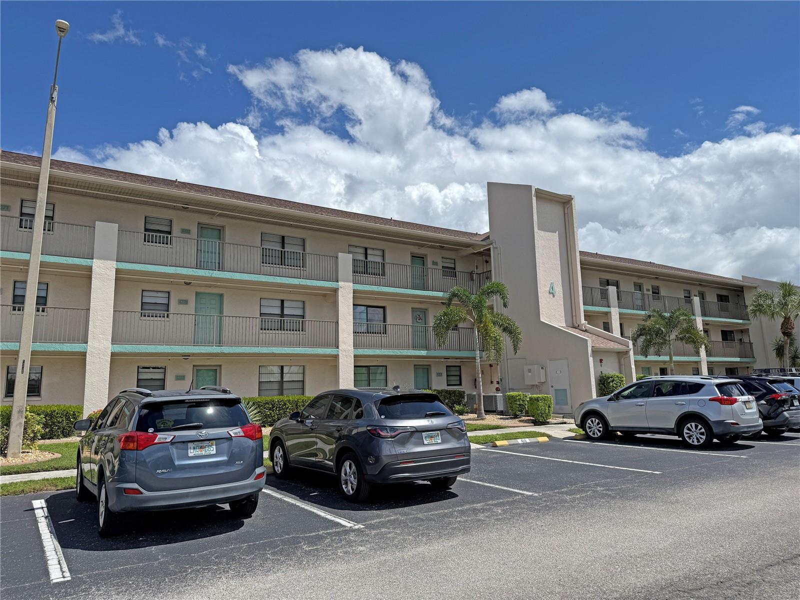 Delightful FIRST FLOOR 2 Bedroom, 2 Bathroom condo unit at NEWPORT CONDOMINIUMS. This vacant unit is ready for you to move right in! This unit offers an open and split bedroom floor plan with Great Room, well equipped Kitchen, laundry closet with front loading washer and dryer and 14x8 screened porch with vinyl windows. The Kitchen features a breakfast bar, double sink and good counter and cabinet space and appliances include oven/range, dishwasher, disposal, built in microwave, refrigerator. The great room opens to the screened porch via sliding glass doors. The master bedroom suite features lanai access, a walk in closet and private bathroom with walk in shower. There is a generous sized guest bedroom with double closet and the guest bathroom has a tub/shower combination. A/C 3 years old, Washer and Dryer 2025....Hot Water Heater  Feb 2026.....Luxury Vinyl Flooring. This is a wonderful community offering a large heated community pool, tennis courts, shuffleboard, grill area, clubhouse and more. The location is wonderful - minutes from Golf, shopping, dining, entertainment, I-75.
