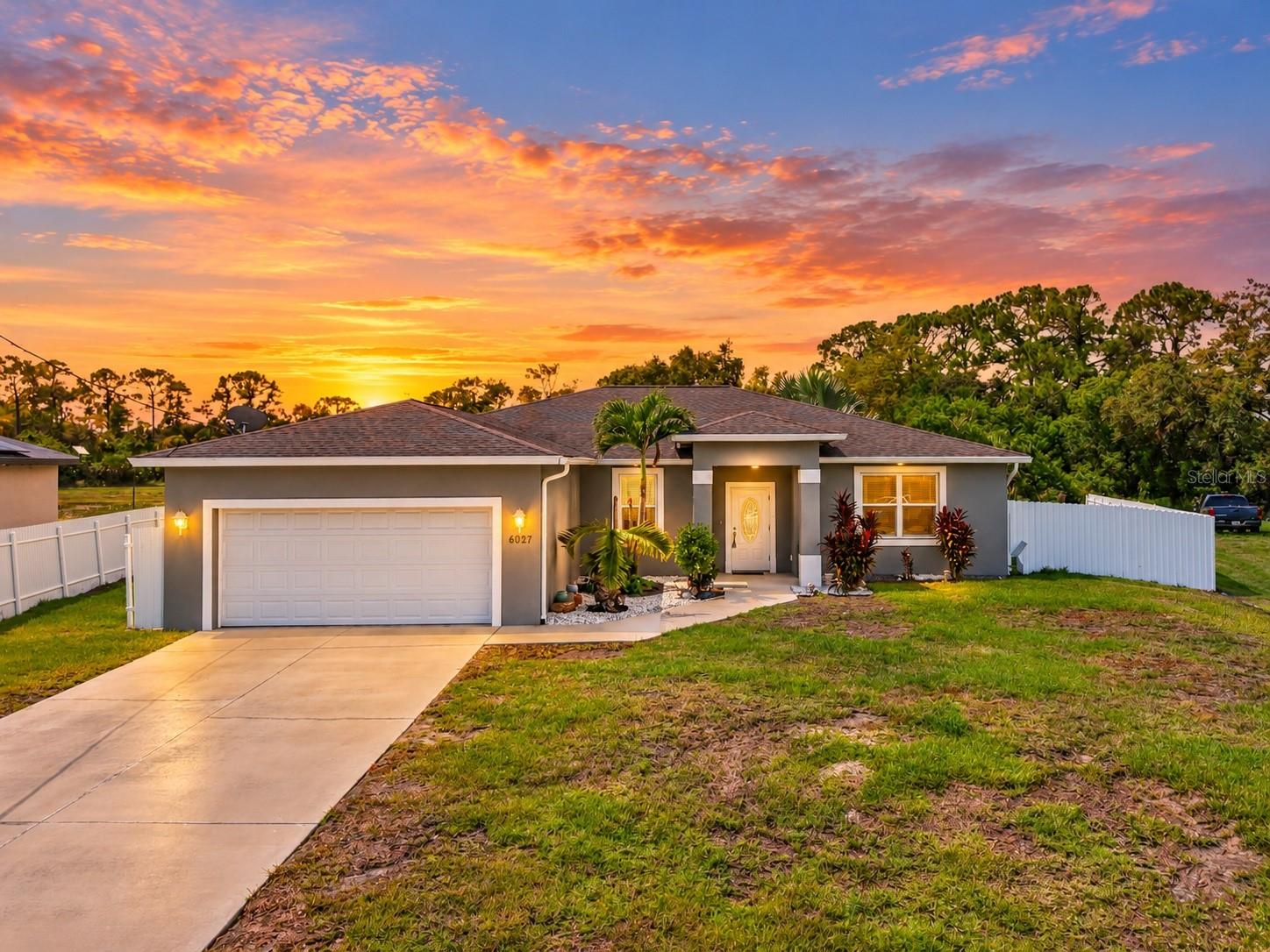 Welcome to 6027 Acorn Circle in Port LaBelle, where comfortable Florida living meets modern style and everyday convenience. Built in 2019, this spacious 3-bedroom, 2-bath home offers 2,068 square feet of living space and sits on approximately 0.27 acres. The thoughtfully designed split-bedroom floor plan provides privacy while the open-concept main living area creates an inviting space for both everyday living and entertaining. The kitchen features granite countertops, a large cooking island with breakfast bar seating, ample cabinetry, and a spacious dining area that flows naturally into the living room. Tile flooring and ceiling fans add to the home's easy Florida lifestyle.

The primary suite offers a comfortable retreat with a private bathroom featuring dual sinks, while the additional bedrooms provide flexibility for family, guests, a home office, or hobbies. A convenient interior laundry area and attached two-car garage add functionality to the home.

Step outside to enjoy the fenced yard and patio, offering space for outdoor dining, relaxing, gardening, or enjoying Florida's year-round sunshine. With no HOA, you'll have the freedom to enjoy your property without the restrictions and additional fees commonly associated with many communities.

Located in Port LaBelle, this home offers a peaceful residential setting while remaining conveniently close to the amenities of LaBelle. The area is known for its small-town atmosphere, natural surroundings, and access to outdoor recreation. Nearby attractions and amenities include the Caloosahatchee River, Port LaBelle Marina, parks, local shops, restaurants, schools, and community services. LaBelle also provides convenient access to surrounding Southwest Florida communities, making this an excellent location for enjoying the quieter pace of a small town while staying connected to the region.

Move-in ready, spacious, functional, and free from HOA restrictions, 6027 Acorn Circle offers a wonderful opportunity to enjoy the best of Port LaBelle living.