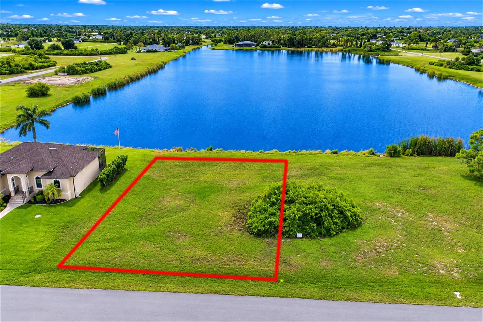 RARE OPPORTUNITY TO OWN A BEAUTIFUL LAKEFRONT LOT WITH SPECTACULAR WESTERN EXPOSURE IN ROTONDA SANDS! Discover the perfect setting to build your Florida dream home on an 8,250-SQUARE-FOOT HOMESITE in the desirable deed-restricted community of Rotonda Sands in Placida. Overlooking one of the community’s largest lakes, this exceptional property offers BREATHTAKING WATER VIEWS AND WESTERN EXPOSURE, providing the ideal backdrop for enjoying beautiful Florida sunsets from your future lanai or pool. THE PROPERTY CURRENTLY CONSISTS OF TWO ADJOINING LOTS THAT ARE IN THE PROCESS OF BEING SPLIT AND WILL BE SOLD INDIVIDUALLY. EACH LOT WILL MEASURE APPROXIMATELY 8,250 SQUARE FEET (0.19 ACRES). THE ADVERTISED LIST PRICE IS FOR ONE LOT ONLY. Conveniently located approximately 4.4 MILES FROM THE BOCA GRANDE CAUSEWAY and 4.1 MILES FROM PUBLIX, you'll enjoy easy access to beautiful Gulf beaches, boating, fishing, golf courses, shopping, dining, and everything Southwest Florida has to offer. Whether you're ready to build now or planning for the future, this beautiful waterfront location presents an outstanding opportunity to create your own piece of Florida paradise!