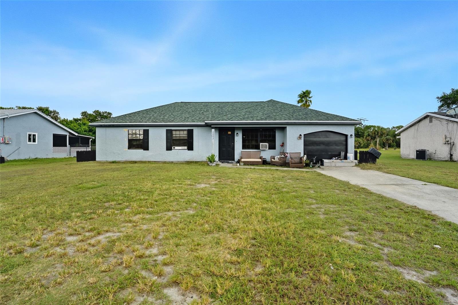 Charming 3-bedroom, 2-bath home with a 1-car garage and a spacious backyard, ideally located in a well-established area of Labelle. This home features tiled floors in the living and dining areas, a roof and A/C from 2018, and fresh interior and exterior paint. The guest bathroom includes an updated tub for added comfort. Perfect as a starter home or investment property, this move-in-ready residence is waiting for its next owner to make it their own.