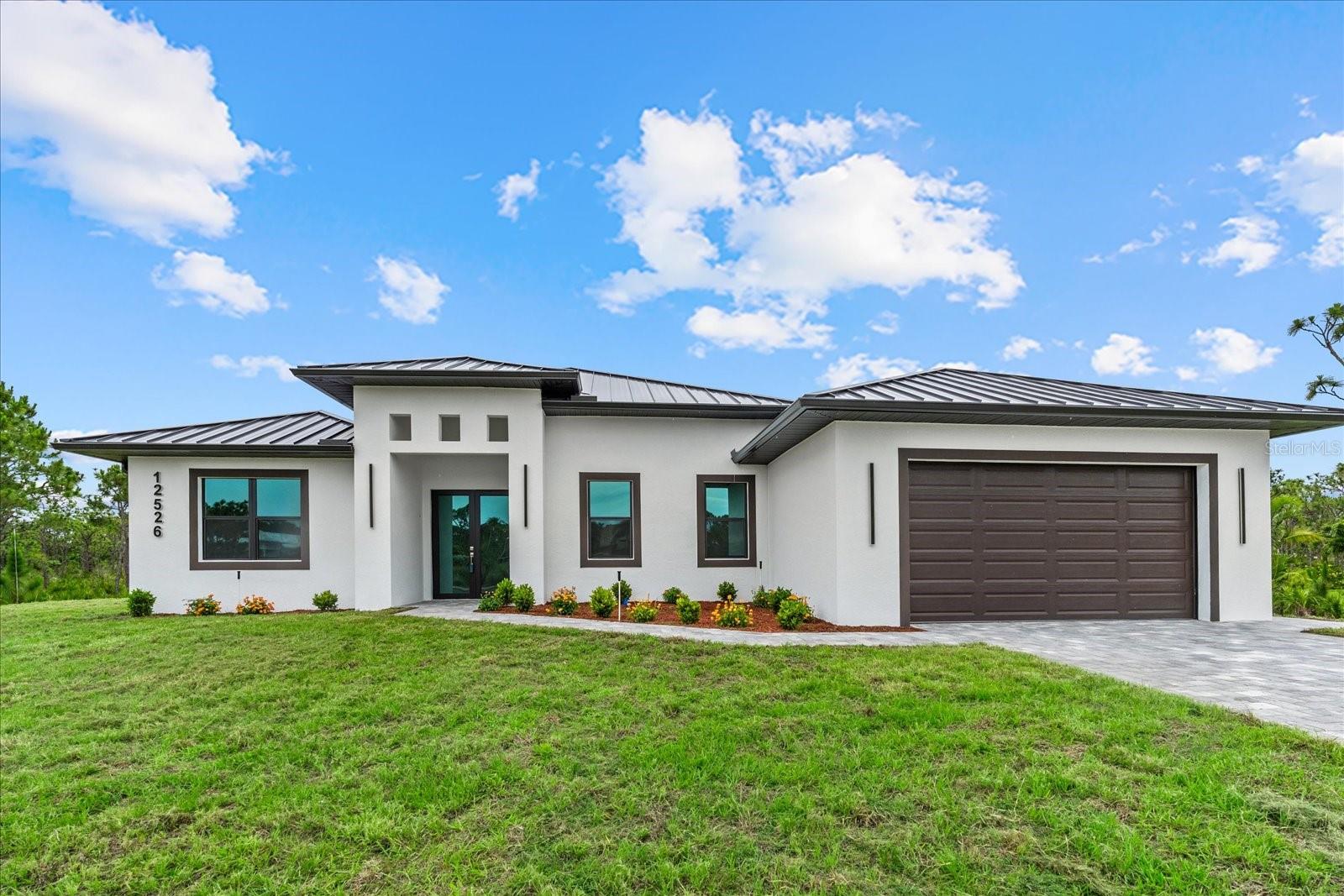 Welcome to this luxurious, BRAND NEW DREAM HOME—never before lived in! Featuring 4 spacious bedrooms, 3 full bathrooms, and a versatile den that can easily serve as a fifth bedroom, this exceptional residence offers the perfect blend of elegance, comfort, and functionality. The thoughtfully designed layout includes both a lavish primary suite and a private junior suite, making it ideal for multi-generational living or accommodating guests in style. Meticulously crafted with exceptional attention to detail, this home showcases designer flooring throughout, a gourmet kitchen equipped with premium appliances, beautifully appointed bathrooms, and a durable metal roof complemented by matching metal soffit and fascia, room for a pool and much more.