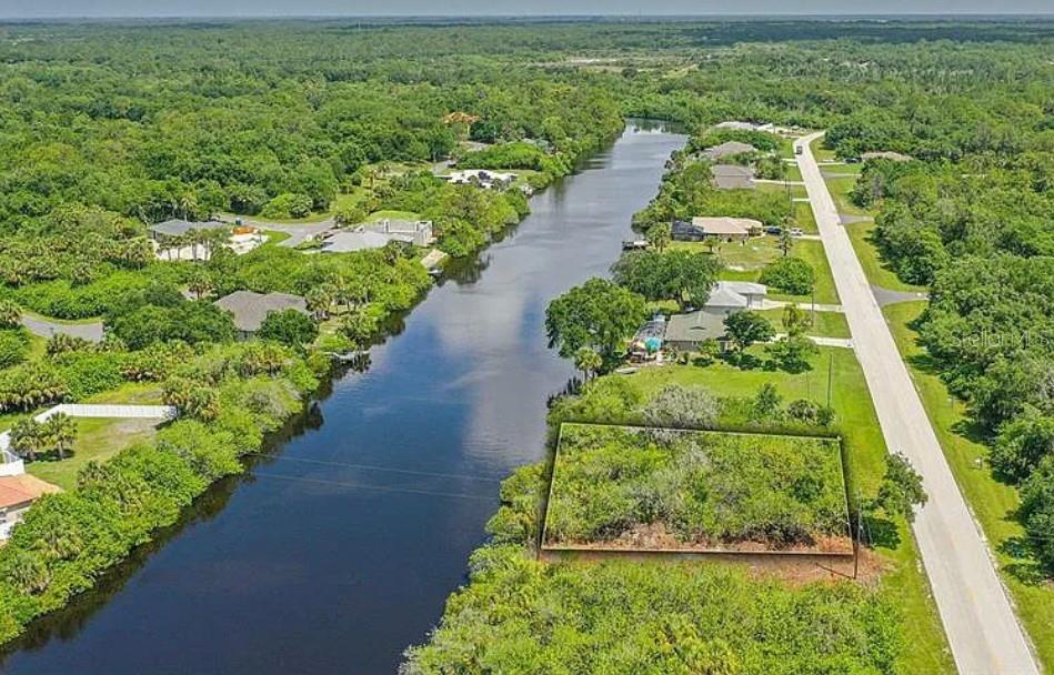 WATERFRONT BUILDABLE LOT! Discover the opportunity to build your dream home on this beautiful canal-front lot located on Sam Knight Creek in the heart of Port Charlotte. Enjoy the peaceful Florida lifestyle surrounded by nature, with waterfront views and opportunities for fishing, boating, kayaking, canoeing, paddleboarding, or simply relaxing and watching the beautiful Florida sunsets. With NO HOA fees and NO deed restrictions, this property offers added flexibility to create your ideal Florida retreat or investment property. Located in a growing area of Charlotte County, this property offers a wonderful combination of tranquility and convenience, with restaurants, shopping, parks, golf courses, and everyday amenities just a short drive away. Baseball spring training facilities, local entertainment, and the stunning Gulf Coast beaches of Boca Grande and Manasota Key are also within driving distance. Enjoy the best of Southwest Florida living while taking advantage of the area's continued growth and development. Whether you are ready to build your forever home, create a seasonal getaway, or invest in a growing market, this waterfront lot offers endless possibilities. Don't miss this opportunity to own a piece of Florida paradise!