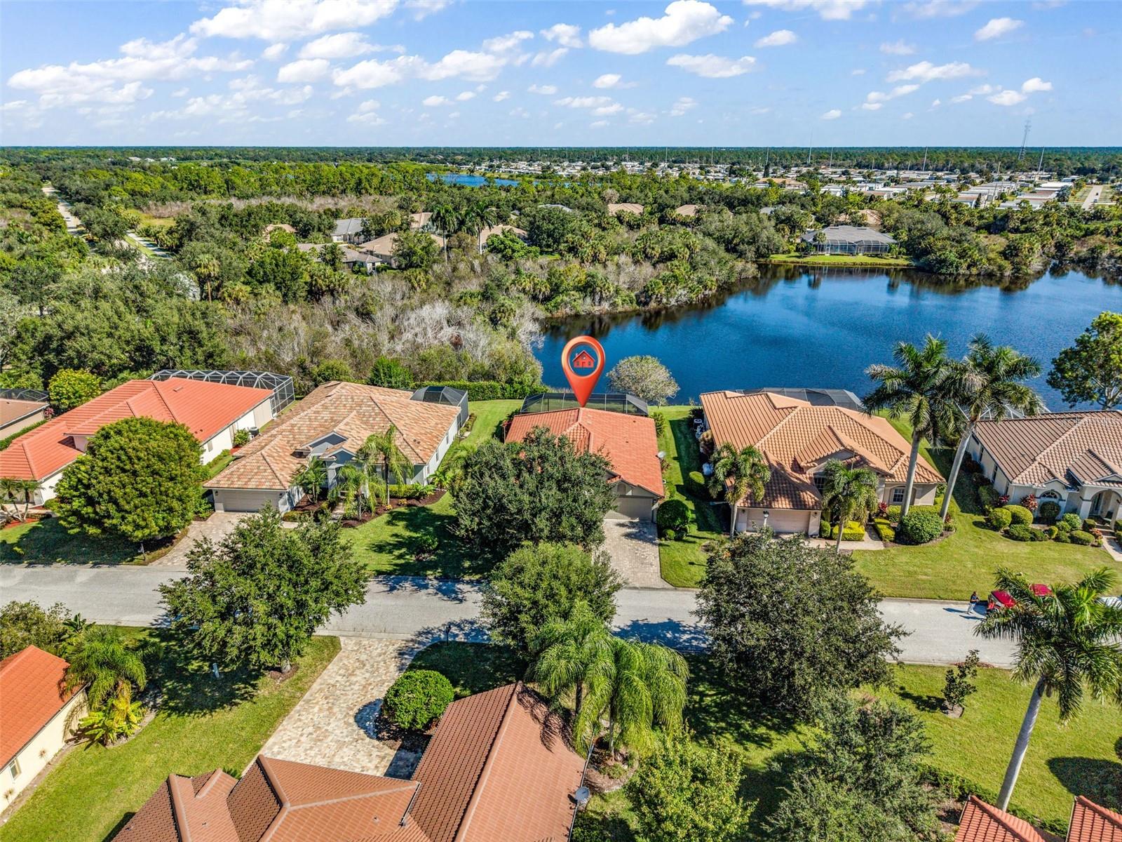 BREATHTAKING WATER VIEWS, PRIVATE POOL & SPA, RESORT-STYLE LIVING, AND TRANSFERABLE BEACH CLUB MEMBERSHIP! Welcome to the beautiful, peaceful community of Riverwood! This furnished, move-in ready 3-bedroom, 2-bathroom home offers the ultimate Florida lifestyle, with spectacular water views that truly steal the show! Step outside to your private backyard oasis featuring a heated in-ground pool and attached spa overlooking the tranquil water. The expansive lanai cage, completely replaced in 2023, features a panoramic picture screen that beautifully frames the water and surrounding natural scenery. An ample covered patio with pavers provides the perfect setting for relaxing, entertaining, or simply soaking in the peaceful surroundings. Inside, vaulted ceilings, diagonal tile and engineered wood flooring, and open living areas create a bright, welcoming atmosphere. Expansive sliding glass doors open fully to the lanai, seamlessly blending indoor and outdoor living. The kitchen features Corian countertops, wood cabinetry, and appliances purchased in 2019. The spacious primary suite offers a walk-in closet and sliding glass doors leading directly to the lanai, while the en-suite bathroom features dual sinks, a soaking tub, separate walk-in shower, and convenient access to the covered patio. MAJOR UPDATES include a NEW ROOF (2024), WATER HEATER (2026), LANAI CAGE & PICTURE-WINDOW SCREEN (2023), POOL HEATER (2023), POOL PUMP (2024), SPA PUMP (2024), POOL MOTOR (2022), and HVAC (2017). Additional features include a reverse osmosis system, irrigation system, metal hurricane shutter panels, accordion shutters for the rear patio, and an included washer and dryer. AN EXCEPTIONAL BONUS: a highly coveted, transferable Riverwood Private Beach Club Membership on beautiful Manasota Key! Beyond the home, Riverwood is a beautifully maintained, all-ages community offering an impressive selection of amenities, including a community pool, pickleball courts, tennis courts, croquet, a dog park, and more. Golf enthusiasts will also appreciate Riverwood Golf Club, with membership available but not required. Discover the beauty, tranquility, and lifestyle that make this property such a special place to call home.