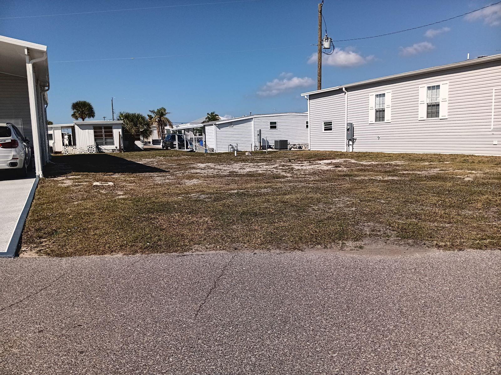 GREAT LOCATION FOR A NEW HOME IN COUNTRY CLUB ESTATES--CLOSE TO ENTRANCE, BIKE PATH, WALKING TRAIL, AND ALL OF THE WONDERFUL AMENITIES THAT THIS COMPLEX HAS .  THE HOME HAS BEEN REMOVED AND THE LOT/SHARE IS READY FOR A NEW ONE AND PERHAPS A BOAT AS WELL.  UP TO A 40' BOAT INCLUDING SAILBOATS CAN BE RENTED BY OWNERS.  SURVEY AVAILABLE.  TAKE A RIDE AND SEE IF THIS IS THE LOCATION FOR YOU.   THIS BEAUTIUL COMMUNITY IS LOCATED ON VENICE ISLAND.  ENJOY THE HEATED POOL WITH WATER AEROBICS AND EXERCISE CLASSES.  CCE HAS TWO CLUBHOUSES, BOTH WITH KITCHENS, ONE CLUBHOUSE HAS A STAGE FOR BANDS AND PERFORMANCES, THE OTHER OVERLOOKS THE WATERWAY WITH RENTED BOAT SLIPS FOR THE RESIDENTS.  FROM THE BOAT CLUB TO THE BOOK CLUB, YOU WILL PROBABLY FIND IT HERE.  PICKLEBALL, SHUFFLEBOARD, CORN HOLE, BILIARDS, PING PONG. LIBRARY,FITNESS CENTER, MOST CARD GAMES, KARAOKE,EVENTS PLANNED FOR THE HOLIDAY, LOCAL BANDS AND DJ;S FOR DANCES, NEIGHBORHOOD PARADES AND SCAVENGER HUNTS.  THIS IS A LIFESTYLE, NOT JUST A PLACE TO LIVE--COME SEE FOR YOURSELF.