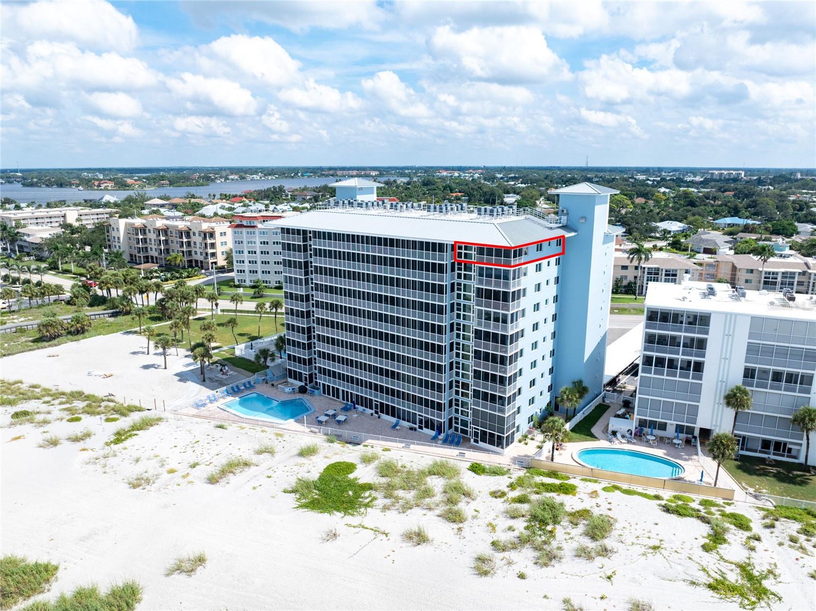 BEACHFRONT LIVING.   PENTHOUSE END UNIT.  PANORAMIC GULF VIEWS.  IMPACT-RESISTANT WINDOWS and SLIDERS.  UPDATES THROUGHOUT.  TURNKEY FURNISHED.  COVETED TANDEM PARKING SPOT. ---------- Welcome to Gulf Horizons, a premier beachfront community on Venice Island.  This light-filled END UNIT offers 1,209 square feet of refined coastal living, featuring 2 bedrooms, 2 bathrooms, and full Gulf views from nearly every room in the condo.  The lanai is screened and has glass sliders with solar blinds, providing an ADDITIONAL 126 square feet of YEAR-ROUND LIVING SPACE to enjoy PANORAMIC GULF VIEWS, spectacular sunsets, and the soothing sound of waves washing up onto your PRIVATE BEACH.  IMPACT RESITANT windows and sliding glass doors provide added peace of mind. ---------- The GOURMET KITCHEN is a Foodie and Chef’s delight!  Its numerous features include Corian counters, a brand-new range, a breakfast bar, a built-in desk, and abundant cabinet space.  The kitchen comes fully stocked with everything you need for meal prep and entertaining, including a clever custom cabinet featuring a professional-grade mixer that pops up directly to the counter.  The primary suite serves as spacious retreat, complete with a large walk-in custom closet and an ensuite bathroom with a walk-in shower.  Both bathrooms feature updated showers and cabinetry with solid stone counters.  The versatile second bedroom is currently utilized as an office with a trundle bed for guests.  Easy-maintenance luxury vinyl plank flooring flows throughout, complemented by fresh interior paint and custom plantation shutters that offer timeless style and excellent light control. ---------- Your unit includes a highly coveted, assigned TANDEM PARKING SPACE that accommodates two vehicles—a rare luxury in the community!  You are also just steps away from the floor's laundry and storage room, shared by only 5 owners per floor.  Your private storage closet is ideal for beach gear and the like.  Gulf Horizons is a secure, smoke-free community featuring security cameras and keypad access to the elevators. ---------- The Gulf Horizons community has recently completed major capital improvements following Hurricane Milton that deliver both enhanced resilience and visual appeal.  Key elements include a newly engineered roof, a fully refurbished pool and associated mechanicals, fresh exterior painting, updated landscaping, resealed windows, waterproofed lanais with brand-new screening, refurbished elevators, new ACs for all units, and a fully remodeled clubhouse complete with a full kitchen and updated bathrooms (nearly complete). ---------- Living at Gulf Horizons also means having 170’ of PRIVATE BEACH as your backyard alongside a heated BEACHFRONT POOL for year-round enjoyment.  And you are walking distance to Venice's picturesque downtown and its diverse dining, boutique shopping, entertainment options, weekly farmer’s market, and regular slate of festivals and concerts at Centennial Park. ---------- Call now for your slice of paradise directly on the Gulf of Mexico!