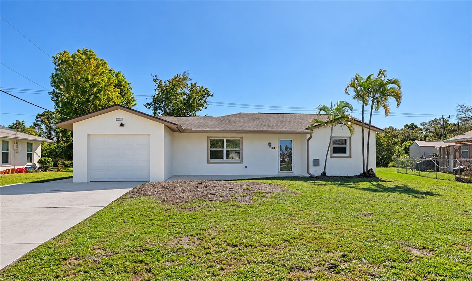 Discover the potential of this charming 2-bedroom, 2-bathroom home with a 1-car garage, ideally situated directly across from the Venice East Golf Course! Featuring a NEW ROOF and FRESH INTERIOR AND EXTERIOR PAINT, this property offers a fantastic opportunity to enjoy the Florida lifestyle while adding your own personal touches. The thoughtfully designed floor plan features two generously sized bedrooms, each complete with a walk-in closet and its own private bathroom, providing comfort and privacy for residents and guests alike. The spacious living areas flow seamlessly to a screened lanai, creating the perfect setting to enjoy your morning coffee, entertain friends, or simply relax while overlooking the backyard. Situated on an oversized, pie-shaped lot, the property offers exceptional outdoor space, privacy, and endless possibilities for landscaping, gardening, or creating your own backyard retreat. An extended driveway provides additional parking while maintaining convenient access to the attached garage. Additional features include ample storage, a large linen closet, city water and sewer. Conveniently located near shopping, dining, golf courses, beautiful Gulf Coast beaches, and historic Downtown Venice, this home combines an excellent location with outstanding potential. Whether you're searching for a seasonal getaway, full-time residence, or investment opportunity, this property offers a great foundation to make it your own. With a new roof, fresh paint inside and out, and a spacious lot in a desirable Venice location, the possibilities are endless!