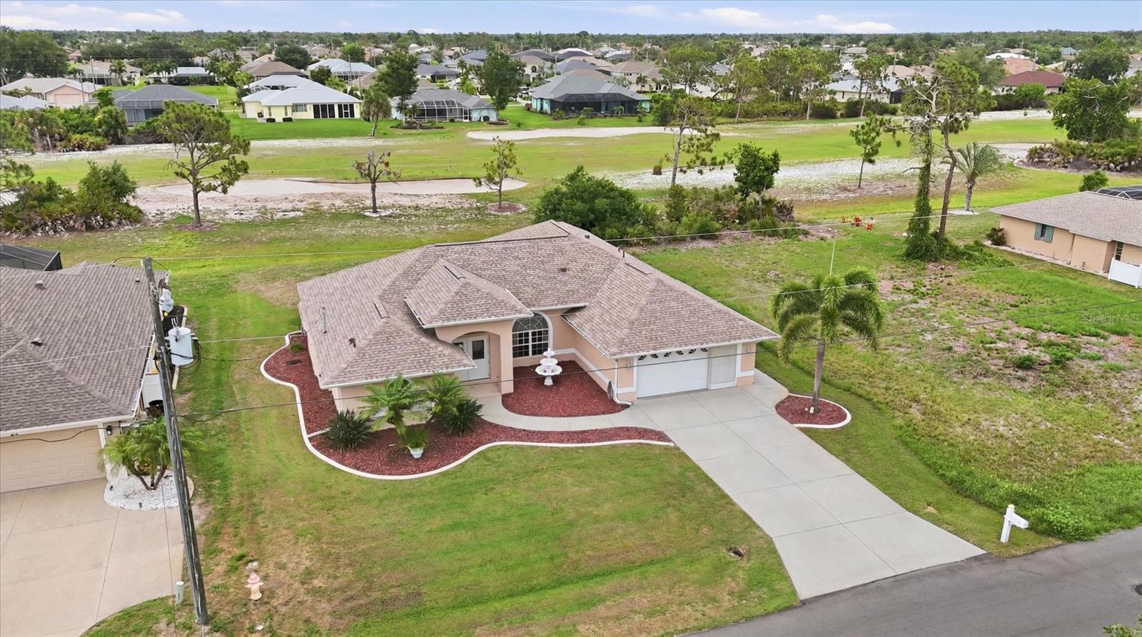 Incredible price per square foot for this over 2200 sq ft home with GOLF COURSE VIEWS! Immaculate, TURN-KEY FURNISHED, this spacious 3-bedroom plus flex space, 2-bath home and oversized garage offers the Florida lifestyle you've been dreaming of. Nestled within the sought-after community of Rotonda West and located in an X Flood Zone (where most lenders do not require flood insurance), this move-in ready residence combines comfort, convenience, and peace of mind with a NEW ROOF installed in 2022. Whether you're looking for a full-time residence, seasonal escape, or investment opportunity, you'll love the open layout, serene views, and expansive backyard with plenty of room to easily add the pool of your dreams while still enjoying generous outdoor living space. Inside, you'll find a bright and inviting split-bedroom floor plan designed for both everyday living and entertaining. Natural light fills the home, while the open layout creates a seamless flow between the living, dining, and kitchen spaces. The kitchen serves as the heart of the home and features ample cabinetry, plenty of counter space, and a charming eat-in breakfast area with a stunning bay window overlooking the golf course and peaceful natural surroundings beyond. The spacious primary suite offers a private retreat with walk-in closets and an ensuite bathroom complete with dual vanities and a tiled walk-in shower. On the opposite side of the home, guests can enjoy their own privacy with generously sized bedrooms. One guest bedroom features a desirable bump-out addition, creating a flexible space perfect for a home office, fitness area, hobby room, reading nook, or whatever best suits your lifestyle. Step outside and discover one of the property's most exciting features—a large backyard overlooking the golf course with endless possibilities. Enjoy your morning coffee while watching local wildlife, entertain family and friends, or create your own private outdoor oasis. The property is equipped with an irrigation system to help maintain the beautiful landscaping year-round. Located in the highly desirable community of Rotonda West, known for its five golf courses, scenic canal system, walking and biking paths, and relaxed coastal atmosphere, this home is just a short drive to the pristine beaches of Manasota Key and Boca Grande, as well as local restaurants, shopping, boating, fishing, and everyday conveniences. This beautifully maintained, move-in ready home truly offers the best of Southwest Florida living. Schedule your private showing today!
