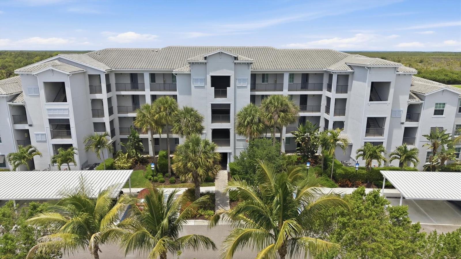 GOLF MEMBERSHIP INCLUDED! PROFESSIONALLY DECORATED! ** Move In ready! ** Bring your clubs, unpack your bags, and start enjoying the season. Professionally decorated and offered turnkey furnished, this two-bedroom, two-bath Birkdale terrace condo at 14091 Heritage Landing Blvd #127 offers an incredible value in Heritage Landing Golf & Country Club in Punta Gorda, Florida. Golf membership is included, and there’s no seasonal lease to work around, so your own Florida getaway can begin as soon as you close.

From the second floor, the view stretches across the lake and the 11th fairway, with a preserve framing the scene beyond. Take your time over morning coffee, watch golfers play through, and let the day unfold without much of an agenda. Come evening, gorgeous sunsets make it tempting to stay right where you are. Inside, custom paint and trim, designer lighting, and beautifully coordinated designer furnishings give the home a welcoming, personal feel. This isn’t an empty condo waiting for your attention—the decorating is done, the furniture is here, and you can get right to enjoying it.

A deeded covered parking space and deeded storage unit add everyday convenience, while the satellite pool is just steps away for a quick swim or a leisurely afternoon. Whether you’re planning winters in the sunshine or looking for a furnished investment property, this home brings together the views, the finishing touches, and the golf lifestyle without starting from scratch.

Your included golf membership gives you access to Heritage Landing’s 18-hole championship course redesigned by Gordon G. Lewis, known for its paspalum fairways and scenic, strategic layout. Ranked #2 in Florida and #11 in the U.S. on GolfPass’s 2023 Golfers’ Choice list, it’s a course you’ll look forward to getting to know. Heritage Landing also earned ICON Management’s 2023 Facility of the Year, recognizing its hospitality, playability, and guest satisfaction.

After a round, meet friends for lunch at the poolside café and full bar, then settle beside the palm-lined, zero-entry resort pool with lap lanes. Four satellite pools offer quieter places to unwind, and fine and casual clubhouse dining make an evening out easy. A fitness center and separate aerobics studio offer space for workouts and classes, while the full-service spa invites you to slow down with a massage or skincare treatment. Six Har-Tru tennis courts, two bocce courts, and six dedicated pickleball courts offer plenty of friendly competition. Pickleball is especially active here, with organized open play, clinics, lessons, and social tournaments welcoming all levels. A full-time activities director brings neighbors together through community gatherings, fitness programs, golf leagues, and seasonal celebrations, making it easy to meet people and find your favorite routines.

Beyond the 24-hour guard-gated entrance, enjoy downtown Punta Gorda’s waterfront restaurants and shops, boating at nearby Burnt Store Marina, and more court time at the PicklePlex, with Punta Gorda Airport convenient for seasonal visits. With the decorating already done, there’s more time for the golf, the sunsets, and the people you’ll meet along the way. HURRY! WON'T LAST! Schedule your personal tour today!