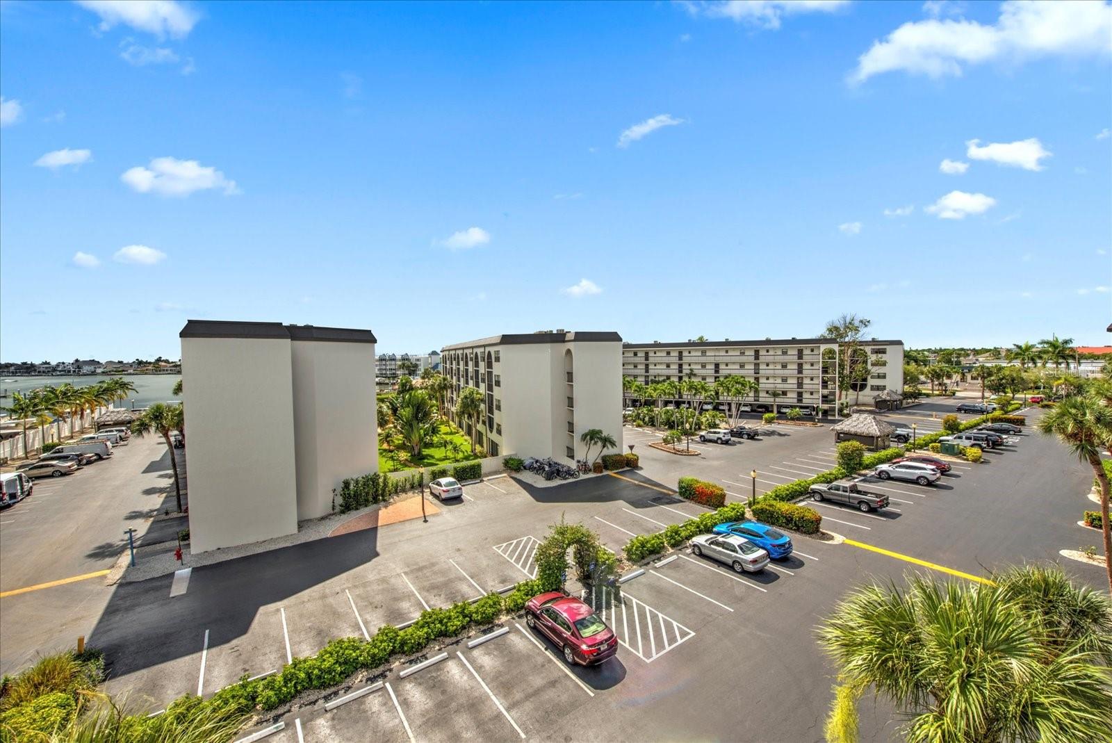 This beautifully maintained 5th-floor condo features one of only a handful of one-bedroom residences in Angler's Cove with water views from every window, creating a light-filled coastal retreat that captures the beauty of Marco Island from every room. Inside, you'll find a thoughtfully updated interior featuring granite countertops, tile flooring throughout, and professionally replaced, upgraded windows and a sliding glass door that enhance energy efficiency, provide peace of mind, and create a clean, modern aesthetic.

Whether you're searching for a personal island escape, a full-time residence, or an exceptional investment property, this condo checks every box. Angler's Cove is one of Marco Island's most sought-after waterfront communities and permits weekly vacation rentals, making it highly desirable for both seasonal enjoyment and outstanding income-producing potential.

Adding even more value, this unit includes an assigned kayak rack—perfect for exploring Marco Island's scenic waterways and enjoying nearby Gulf access. A covered parking space conveniently located beneath Building B is also available for separate purchase, offering a premium convenience that is rarely available within the community.

Residents enjoy resort-style amenities, including two heated pools, multiple spas, tennis courts, and the popular Dolphin Tiki Bar & Grill, all within this gated waterfront community.

Ideally located just minutes from Tigertail Beach, Residents' Beach, Rose Marina, waterfront dining, boutique shopping, fishing, boating, and everything Marco Island is known for, this exceptional condo combines an unparalleled island lifestyle, a premier location, and outstanding investment potential.
