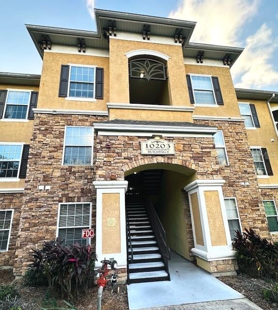 Beautiful 2-bedroom, 2-bathroom second-floor condo for sale in the desirable Courtney Palms community! This inviting home features an open-concept kitchen with stylish wood cabinetry, granite countertops, and stainless-steel appliances. Additional highlights include durable vinyl flooring throughout the main living areas, a screened-in balcony, a convenient desk nook with built-in bookshelves, and spacious walk-in closets. Courtney Palms offers an exceptional lifestyle with convenient access to Highway 301, the Selmon Expressway, and I-75. Residents enjoy close proximity to shopping, restaurants, entertainment, and everyday conveniences. Community amenities include a resort-style swimming pool, clubhouse, racquetball and basketball courts, and a state-of-the-art fitness center. This condo combines comfort, convenience, and resort-style living—schedule your showing today!