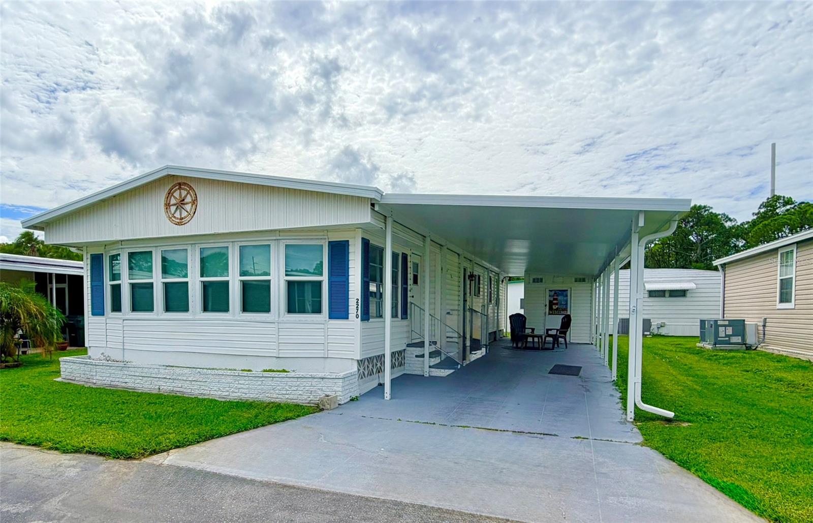 Own a piece of paradise in Venetian Park Estates! This two bedroom, two bath home features a completely renovated 4 season spacious lanai, beautifully decorated with a coastal/nautical flair. The spacious layout has all the comforts of home with just a turn of a key! Recent updates include the stove, refrigerator with ice maker, microwave, subway tile backsplash and both bathrooms. The 2016 HVAC is under a maintenance contract inspected semi-annually. The primary bedroom- en suite, boasts a king size bed with lovely furniture. 
Sarasota is a gorgeous place to call home, with world renowned beaches just 15 minutes away, shopping and dining right around the corner. Venetian Park Estates is an active over 55 community with a beautiful heated swimming pool, hot tub/spa and shuffleboard. Activities include bingo, trivia, themed parties with entertainment and more.