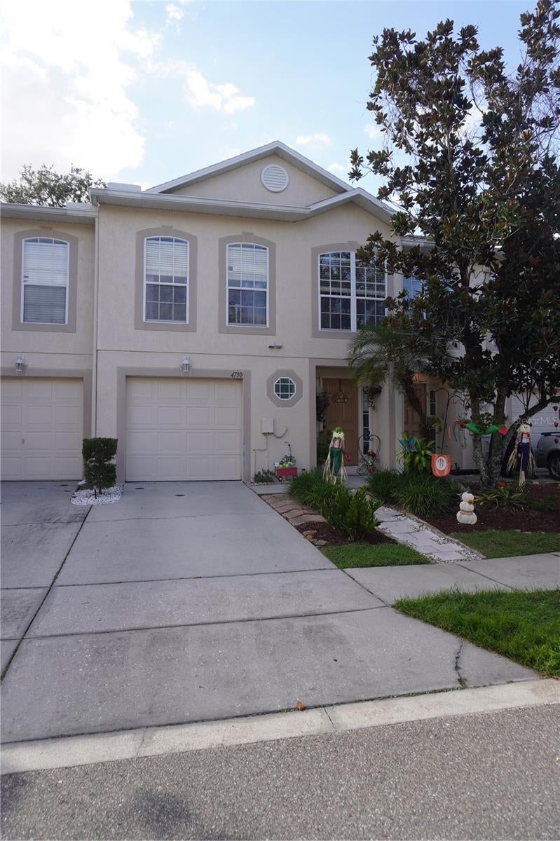 Welcome to Ashburn Square! This well-appointed Maronda-built townhome offers 3 bedrooms, a versatile loft currently used as a 4th bedroom, 2.5 baths, and a 1-car garage. Conveniently located with easy access to Tampa, I-4, Brandon, and Orlando.

The first floor features neutral laminate flooring, a spacious living room with a built-in entertainment center, a convenient half bath, and a downstairs laundry closet. The updated kitchen offers solid-surface countertops and top-of-the-line appliances. Enjoy the Florida lifestyle from the screened-in patio overlooking a garden view, with access to a large community green space.

Upstairs, a custom staircase leads to a bright landing with a large window and a split-bedroom layout. The primary suite features laminate flooring, an en-suite bath, and a walk-in closet. Two additional bedrooms offer laminate flooring and built-in closets, while the flexible loft provides additional living space.

Recent updates include A/C and water heater replaced approximately 4 years ago and garbage disposal replaced approximately 1 year ago. Located in an established community with low HOA fees and community amenities, this home offers a flexible floor plan and convenient access to major roadways. Don't miss this opportunity to make Ashburn Square your new home!