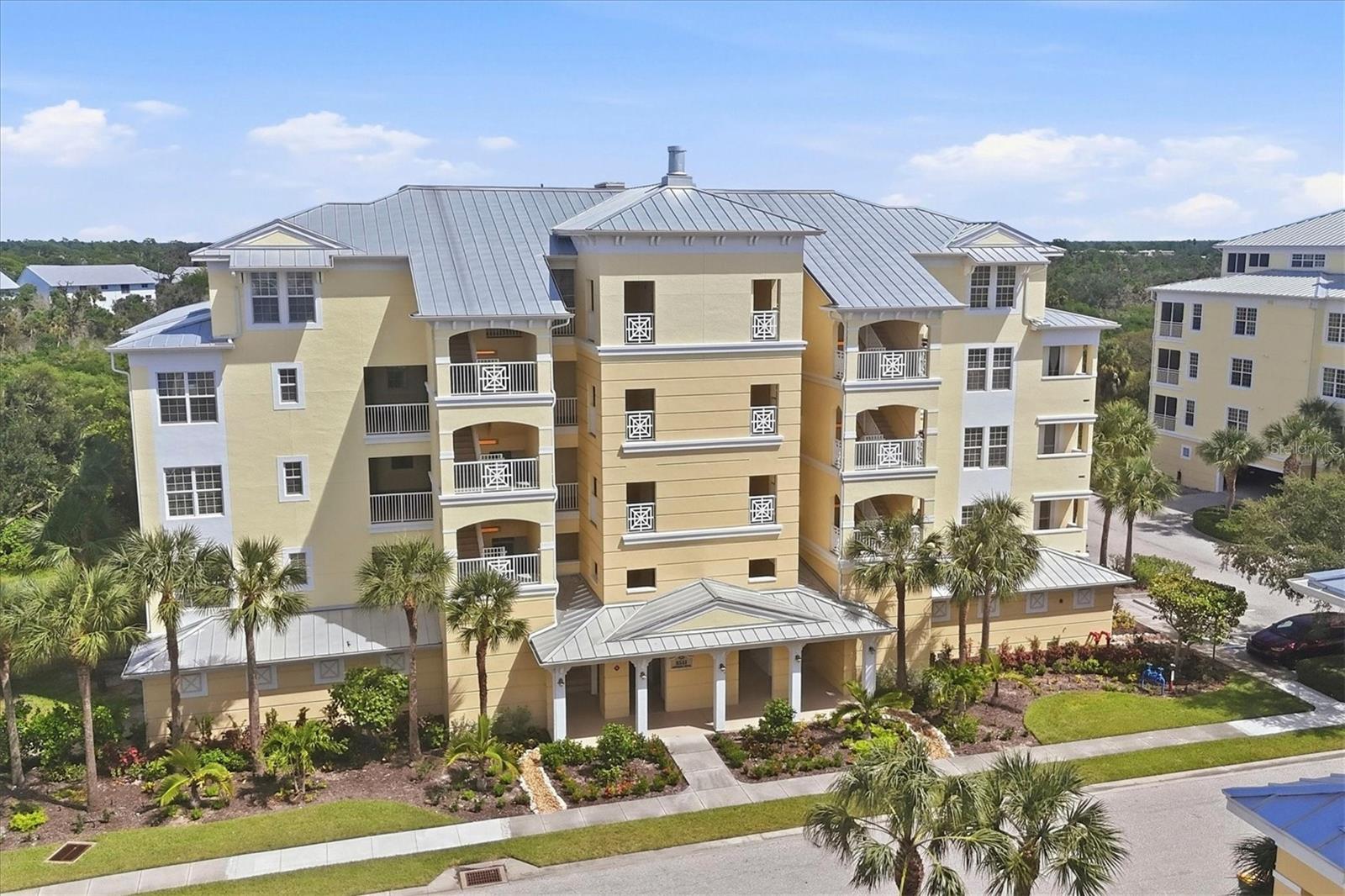 Relaxed Florida living awaits in this sun-soaked, 3-bedroom, 2-bath corner unit. Ten-foot ceilings, crown moulding, and plantation shutters run throughout, setting an elevated tone from the moment you walk in. A cozy dining nook with custom built-in cabinetry welcomes you, flowing into an open-concept kitchen featuring stainless steel appliances, wood cabinetry, and granite countertops. The living room includes a wet bar -perfect for entertaining - and opens out to the lanai, where you can sip your morning coffee while taking in views of the Preserve and its resident wildlife. The primary suite offers a true retreat, with his-and-her california closets, double vanities, a soaking tub, and shower. Two additional bedrooms sit on the opposite end of the unit, offering privacy and comfort for guests. Two assigned parking spots come with the unit - one in the garage with a private storage unit, plus an additional space just outside. Ample guest parking is also available. The Hammocks is a gated community set against an 80+ acre nature preserve, with resort-style amenities including pickleball and tennis courts, outdoor grilling areas, updated clubhouse and fitness center, a heated pool, and a fishing pier. The location offers easy access to Boca Grande and Englewood beaches, marinas, restaurants, golf courses and shopping. Primary bedroom is virtually staged.