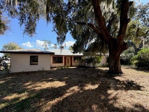 Short Sale. *BANK APPROVED PRICE* Welcome to your Florida oasis at 30 Placid Oaks Drive, Lake Placid, FL 33852! Nestled on a spacious 1.1-acre parcel in the tranquil Placid Oaks neighborhood, this charming single-story residence built in 1987 combines comfort, privacy, and timeless appeal in a picturesque natural setting. Approaching the home, you’re greeted by lush oak hammock landscaping and the inviting presence of a generous front porch — the perfect spot for your morning coffee or greeting guests. Inside, the thoughtfully laid-out floor plan features 3 bedrooms and 2.5 baths, with approximately 2,565 sq ft of interior living space. Large windows and an open flow create an airy, light-filled ambiance throughout, while functional living areas provide comfortable day-to-day living and space for entertaining. Step outside to your private backyard sanctuary — a screened-in lanai opens to a caged, in-ground saltwater heated pool, ideal for year-round enjoyment and low-maintenance Florida living. Imagine relaxing poolside under the sun, hosting weekend barbecues with friends, or simply unwinding in the peaceful setting surrounded by nature. Enhancing the property’s utility and appeal is a substantial workshop with an attached carport and pole barn, offering ample space for hobbies, storage, or projects. Beautifully landscaped yard featuring productive fruit trees, including 2–3 avocado, mango, and one loquat tree. With no HOA restrictions, this home provides flexibility and freedom while still being close to the lakes, shopping, dining, and recreational opportunities that make Lake Placid such a desirable place to live.