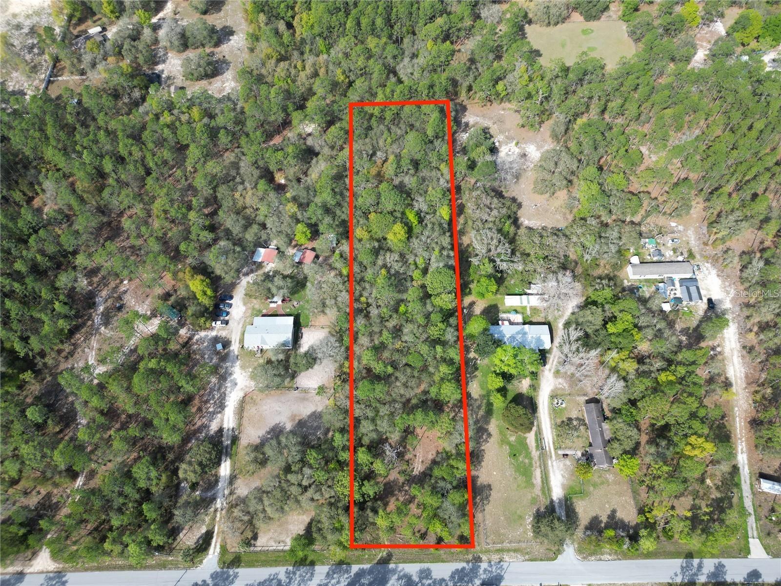Escape to the tranquility of rural living with this picturesque 2.43-acre parcel of vacant land in beautiful Dunnellon, Florida. Surrounded by the serene landscapes of Marion County, this property offers an unparalleled opportunity to craft your own retreat. Embrace the peace and serenity of rural living as you wake up to the sounds of birds chirping and gentle breezes rustling through the trees. This idyllic location provides a respite from the hustle and bustle of city life, allowing you to unwind and recharge amidst nature's embrace. While secluded and private, this property is still within easy reach of Dunnellon's charming downtown area, offering a variety of shops, restaurants, and recreational opportunities. Enjoy the best of both worlds with rural tranquility and urban conveniences just a short drive away. Don't miss out on the chance to make your rural living dreams a reality in Dunnellon, Florida. Whether you're seeking a peaceful retreat, a hobby farm, or simply a slice of nature to call your own, this vacant land offers endless possibilities. Schedule your showing today and start planning your countryside escape! Bonus Opportunity - The adjacent lot behind this property is also available for sale, providing an opportunity to expand your landholding and own close to 5 acres. Take advantage of this rare chance to double your acreage and create the ultimate rural retreat.
